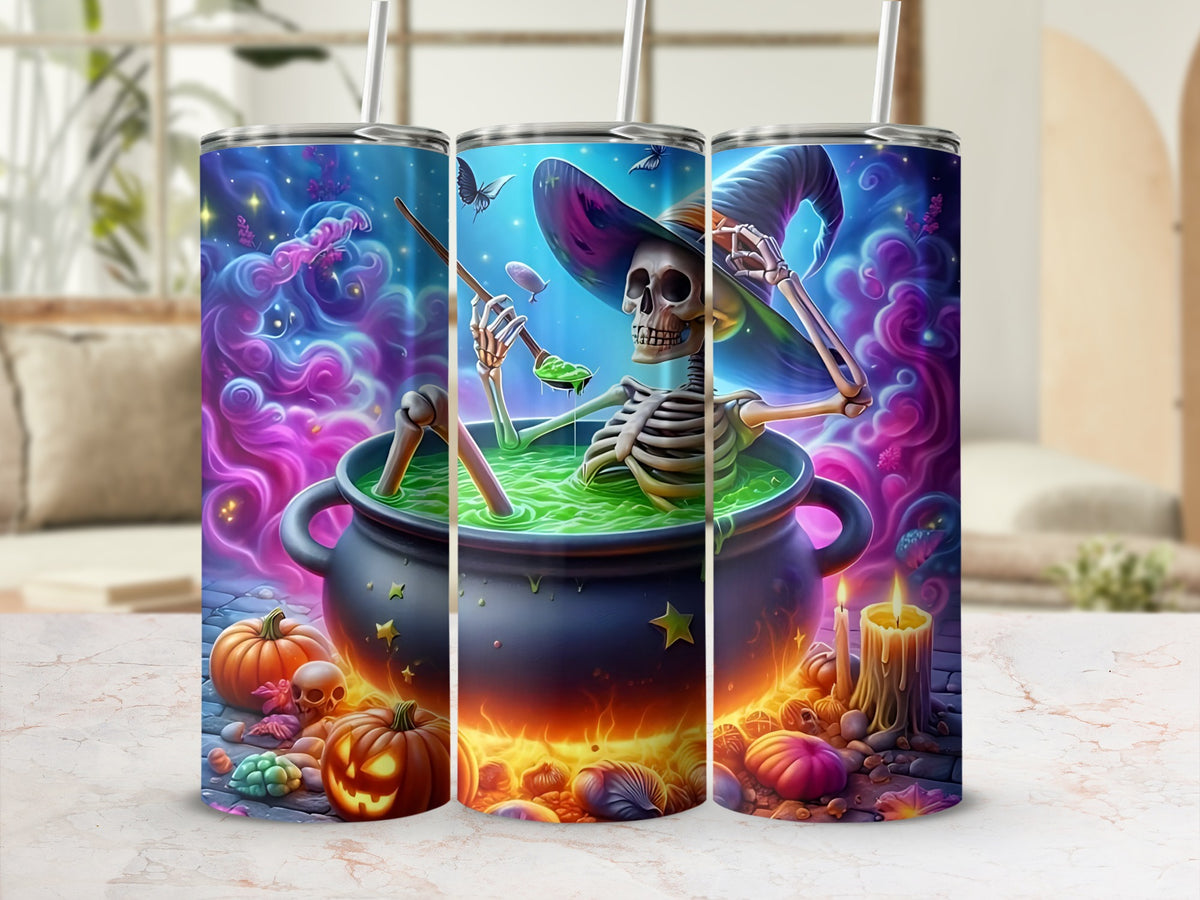 Halloween skinny tumbler with skeleton witch in cauldron and pumpkins.