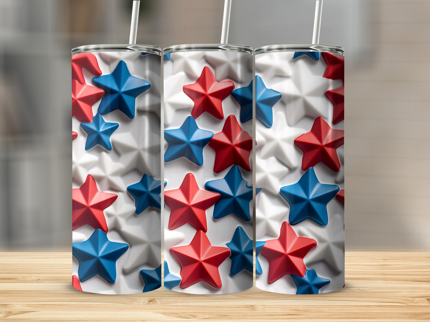 Three tumblers with red and blue star pattern on wood background.