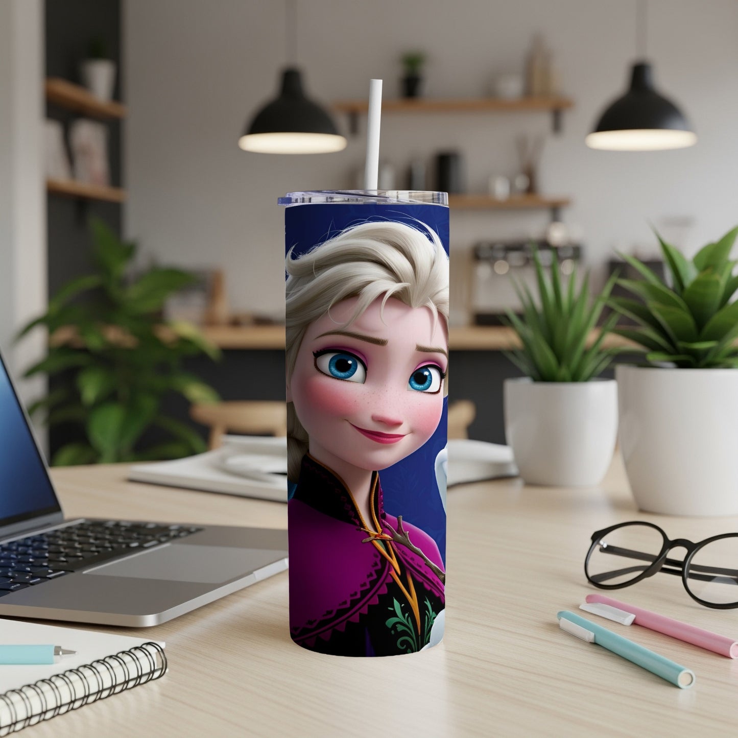 Elsa from Frozen on a blue background on a white tumbler with straw.