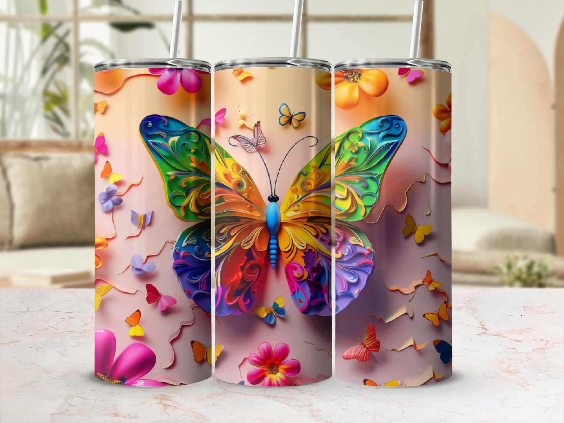 Colorful butterfly art on three tumblers.
