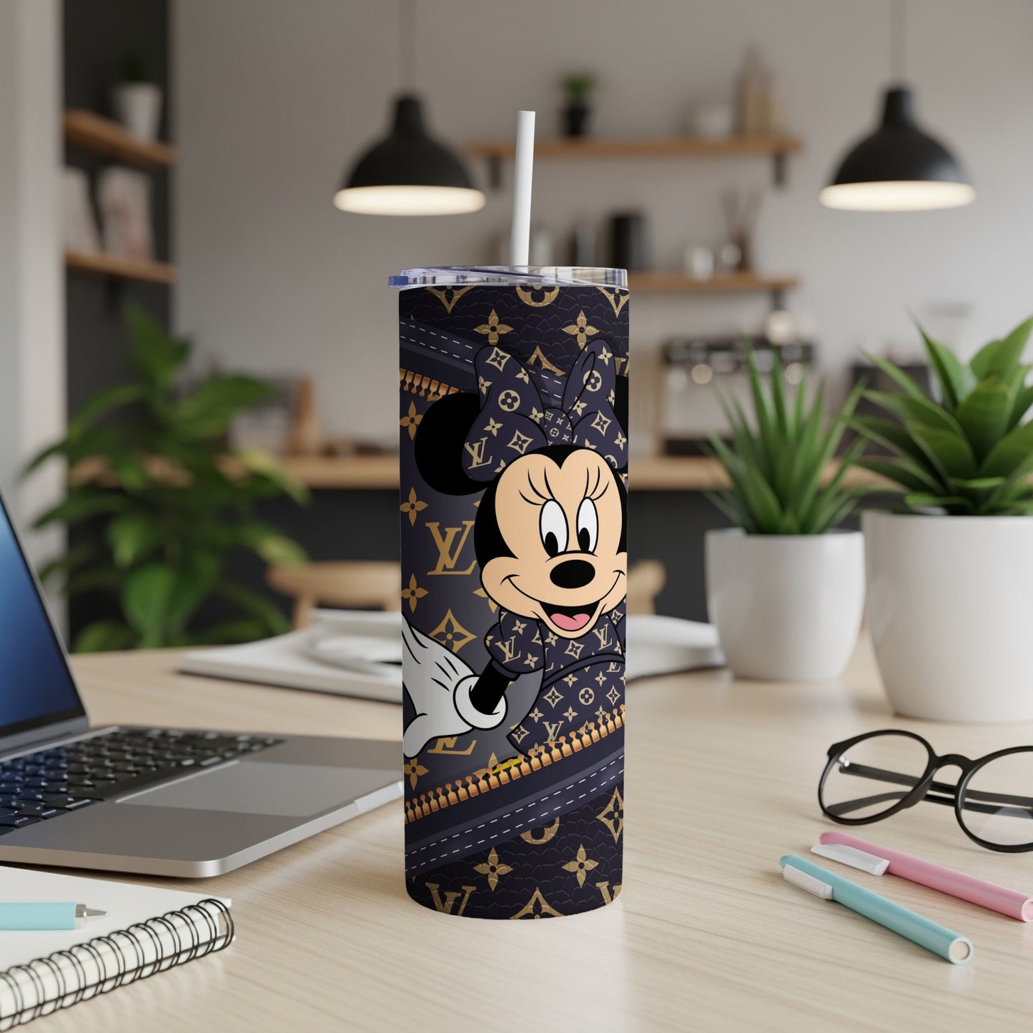 Minnie Mouse on a tumbler with a Louis Vuitton-inspired pattern.