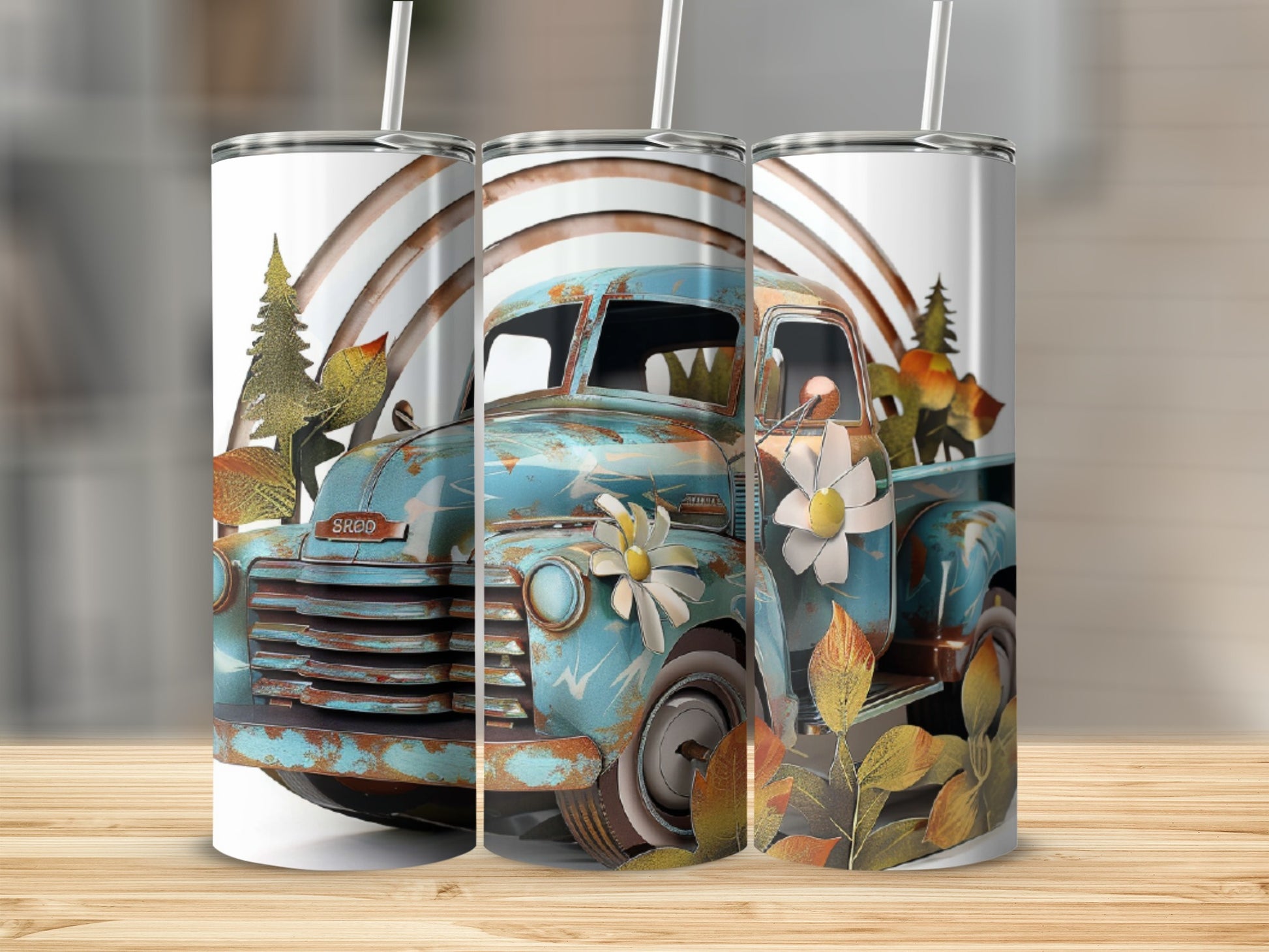 Turquoise vintage pickup truck with autumn leaves and rainbow design on tumblers.