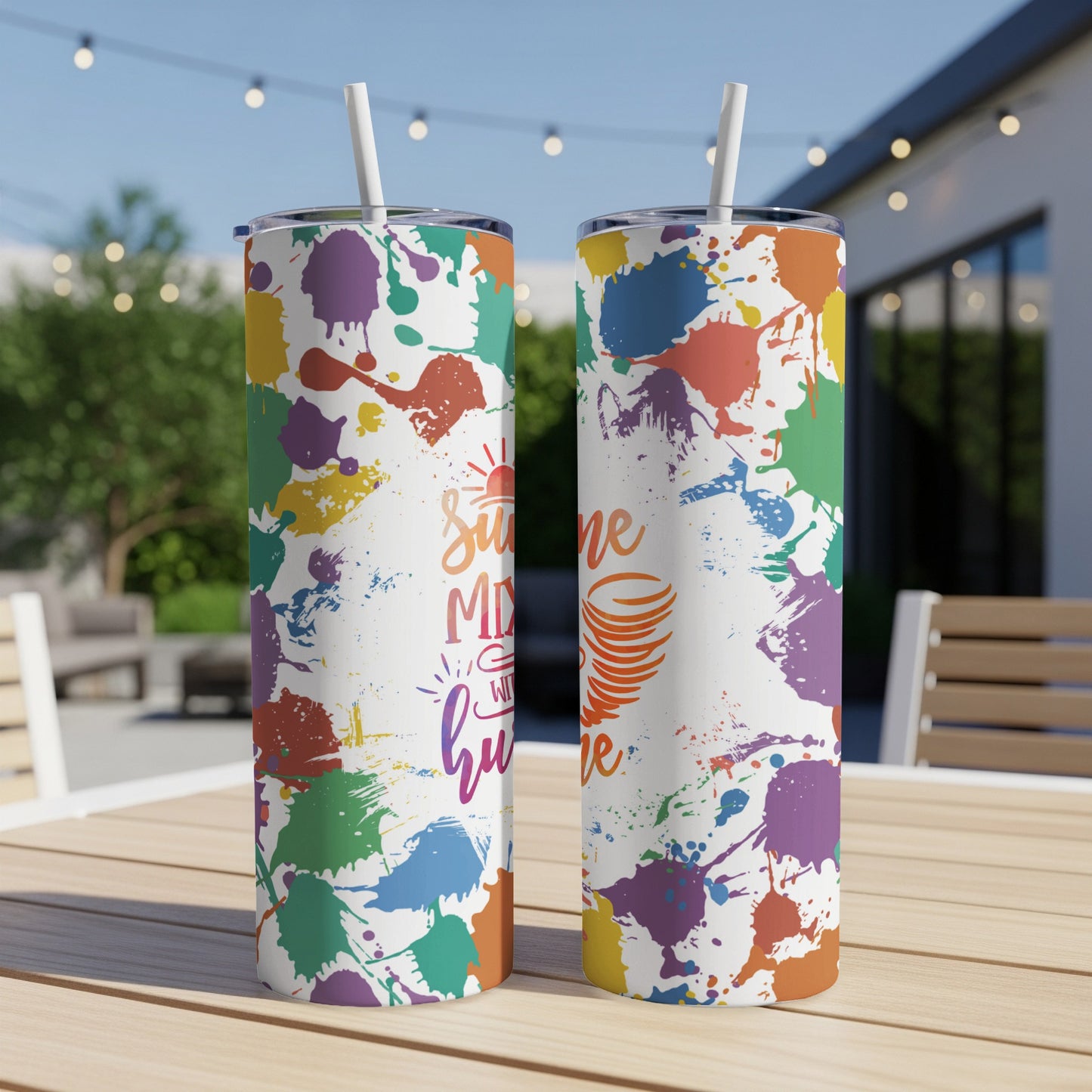 Two tall tumblers with colorful paint splatters and "Sunshine Mixed With Hurricane" text.