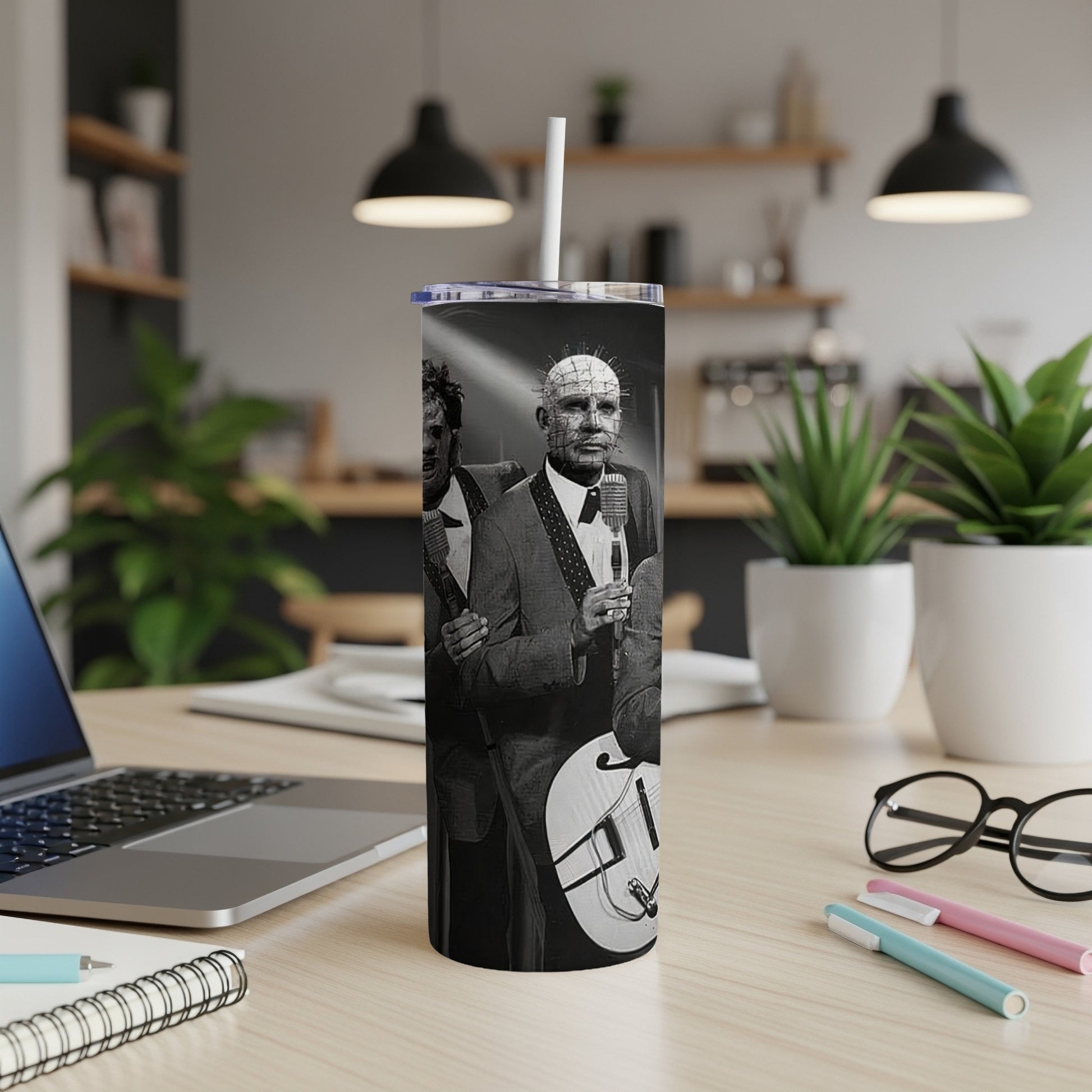Tumbler featuring black and white image of Pinhead and another figure with a guitar.