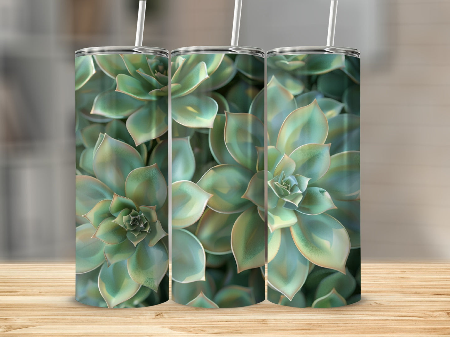 Three tumblers with succulent plant pattern on a wooden surface.