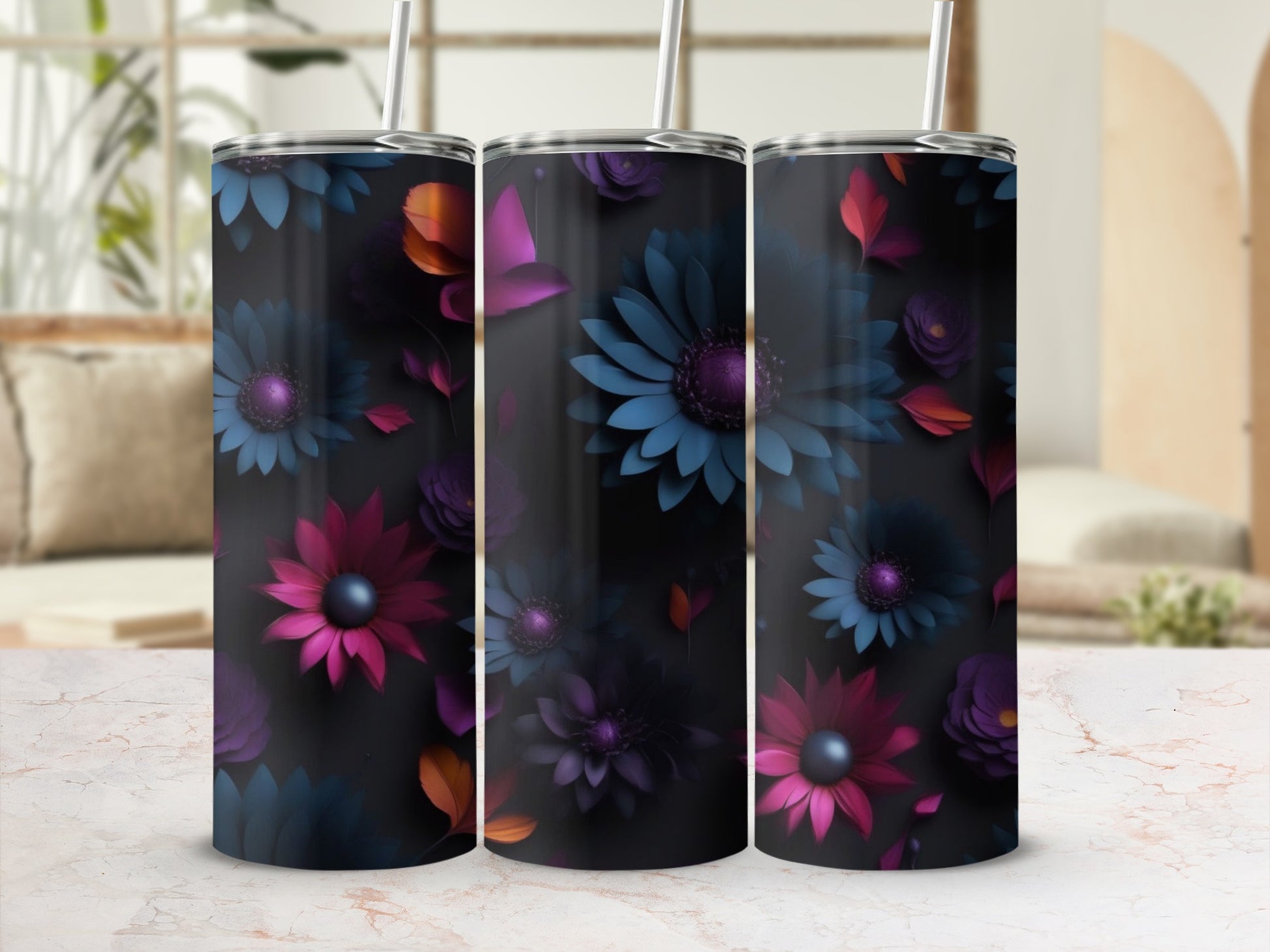 Three tumblers with dark backgrounds and colorful floral patterns.