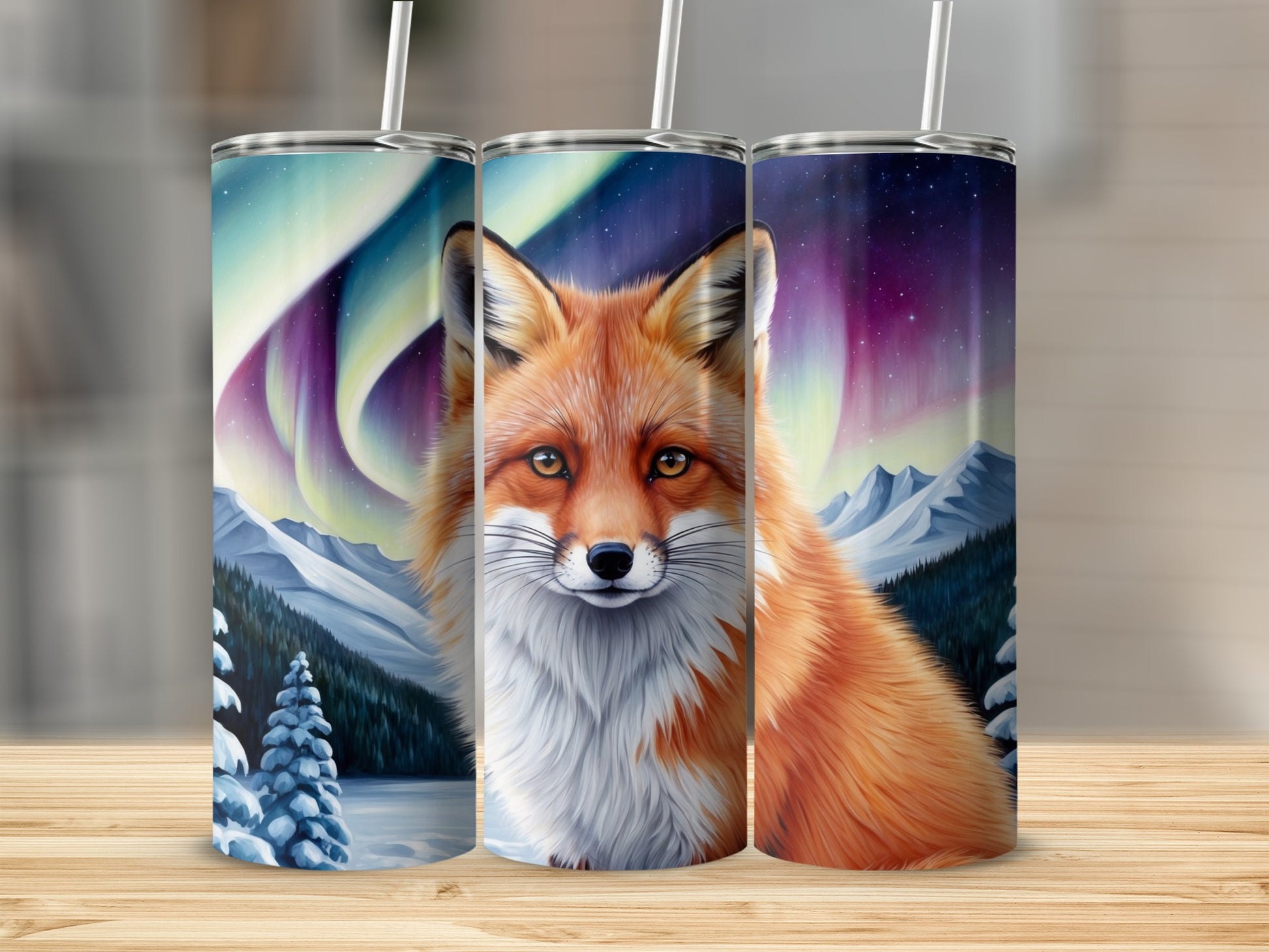 Fox with aurora borealis over snow-covered mountains on three tumblers.