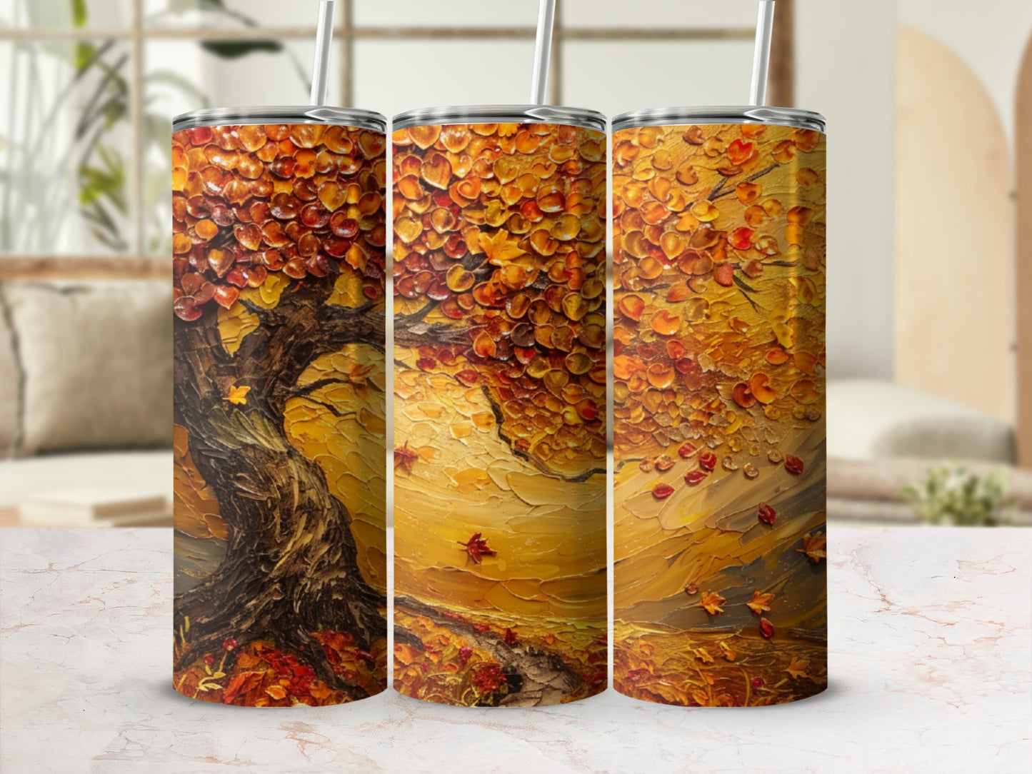 Autumn tree art on three tumblers with straws.