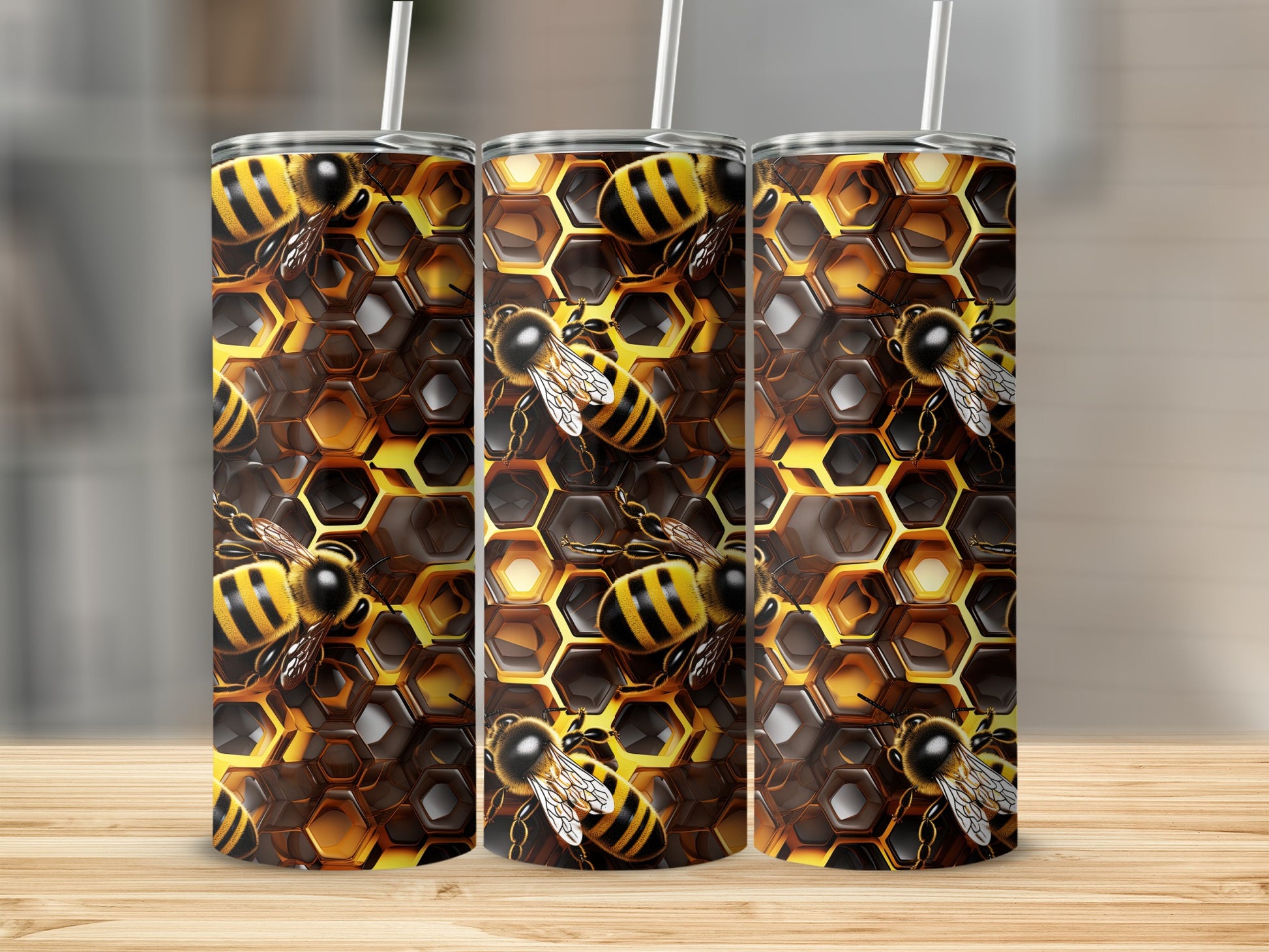 Three tumblers with a honeycomb and bee pattern.