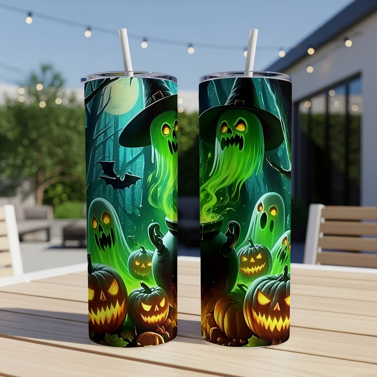 Two tumblers with a Halloween design featuring ghosts, pumpkins, and a witch's cauldron.