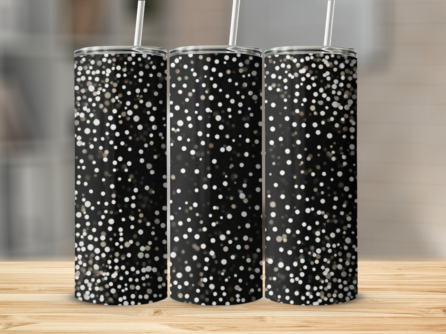 Three black tumblers with scattered white and gold glitter dots.
