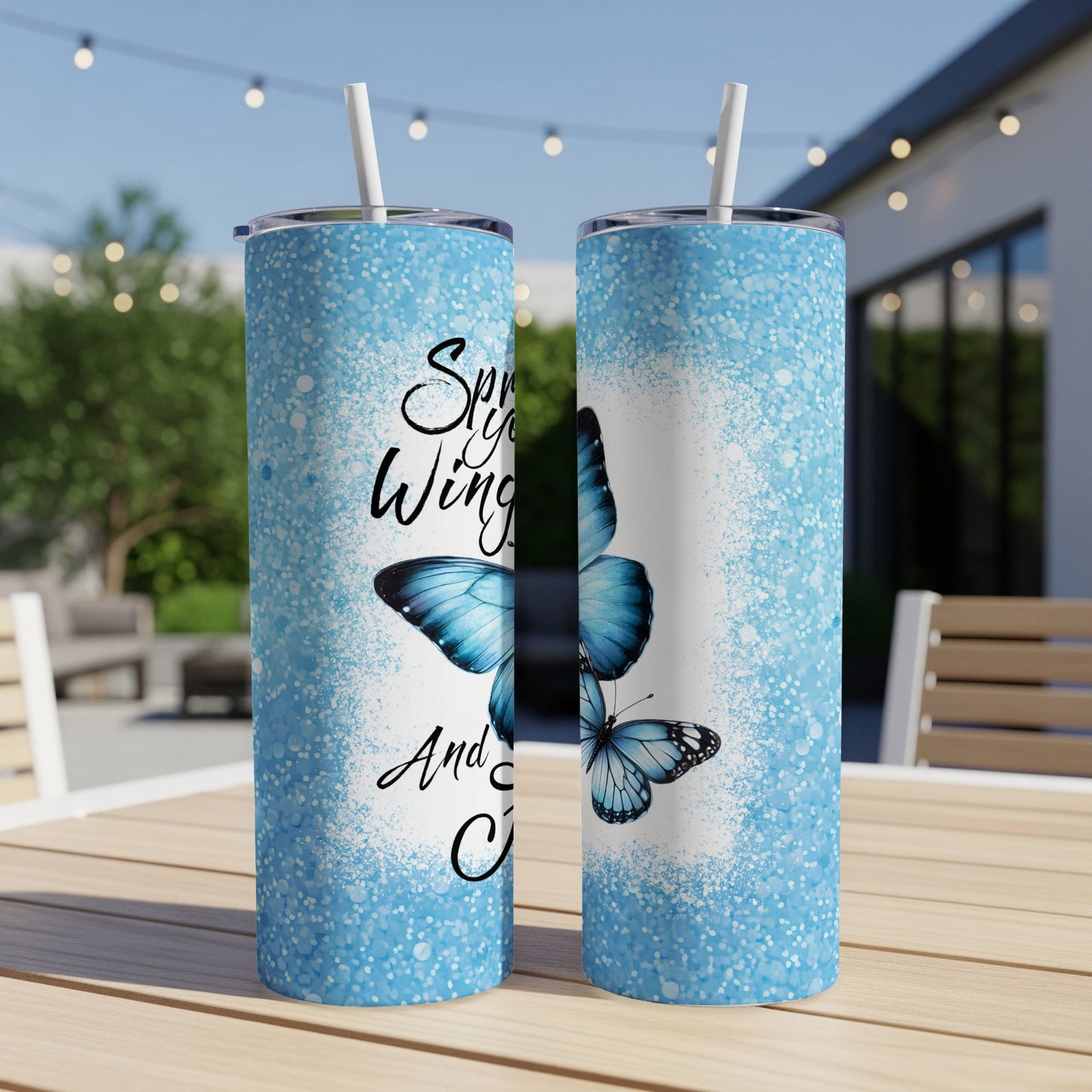 Two blue butterfly tumblers with glittery blue accents and text.