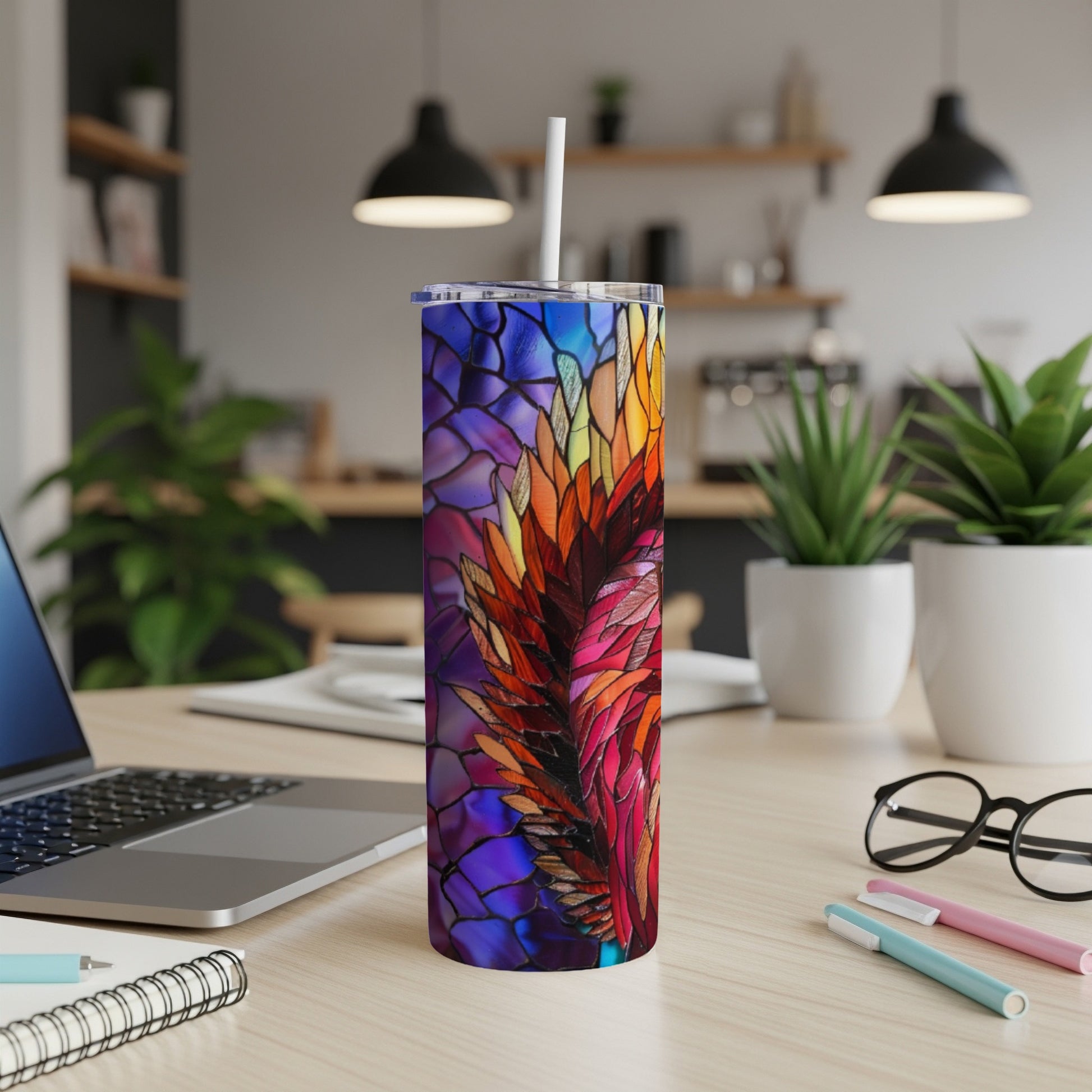 Colorful stained-glass feather design on a white stainless steel tumbler.