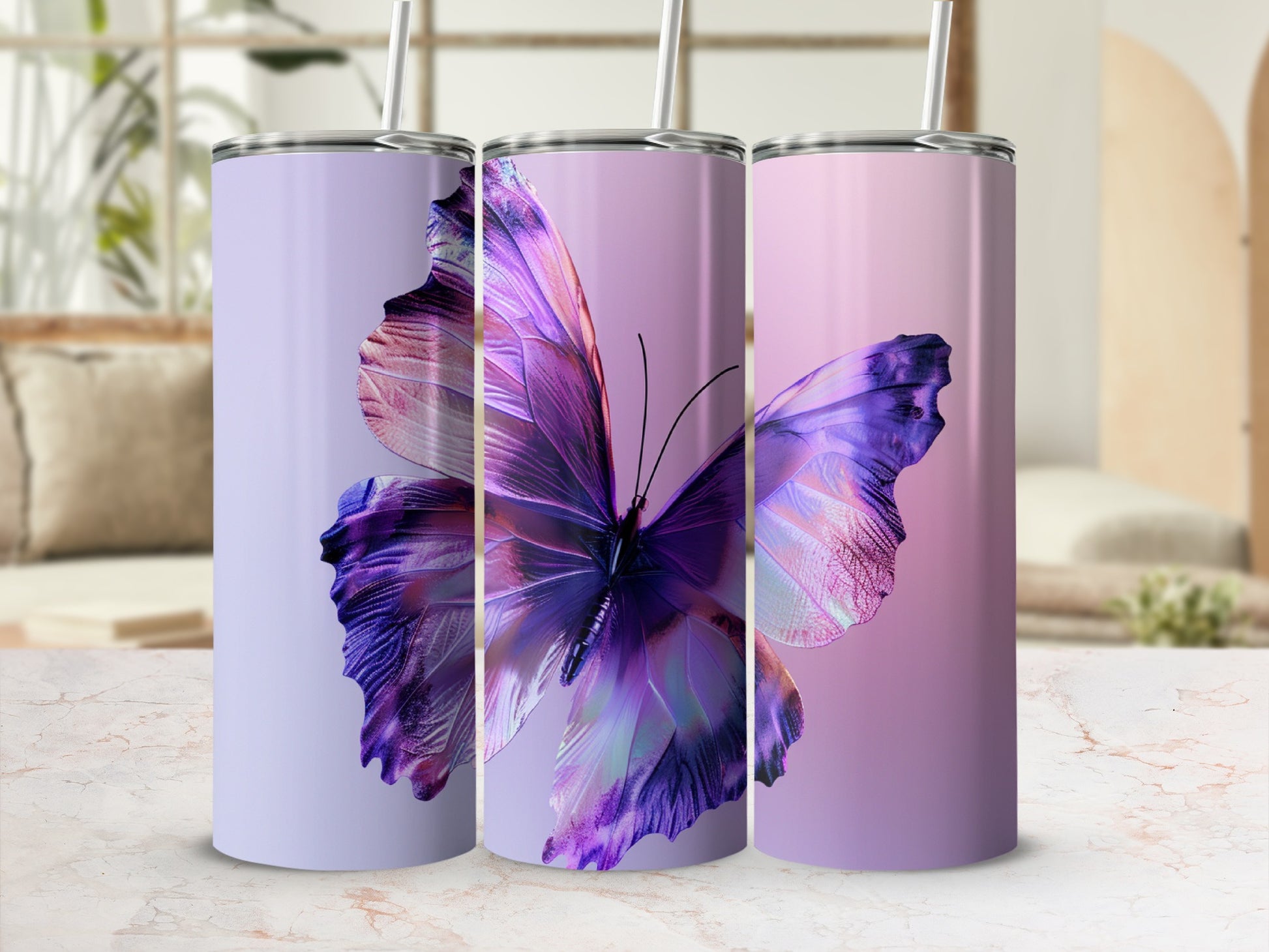 Three purple butterfly tumblers with straws on a marble surface.