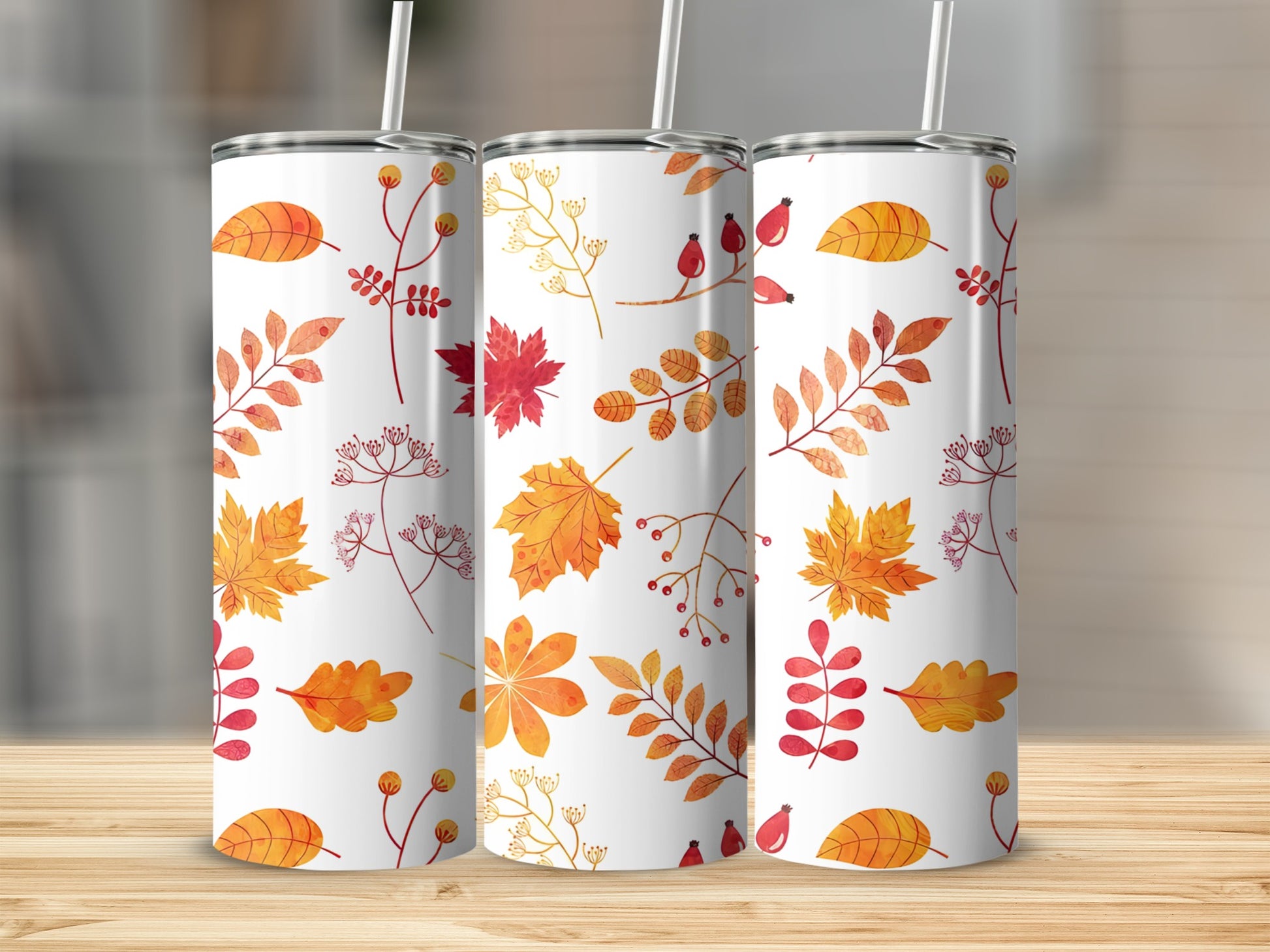 Three white tumblers with a fall leaf pattern.