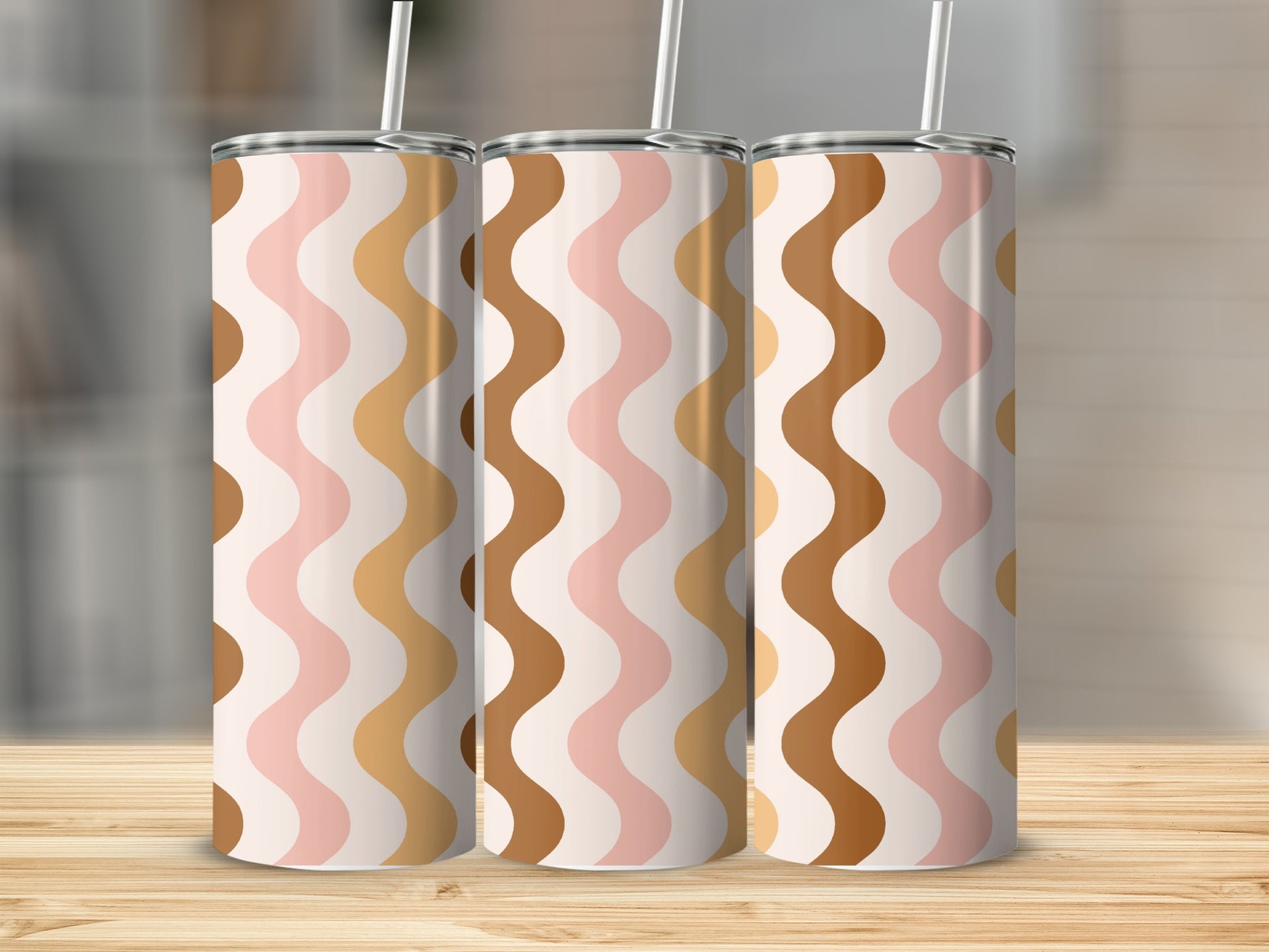 Three tumblers with a wavy pattern in cream, pink, brown, and tan.
