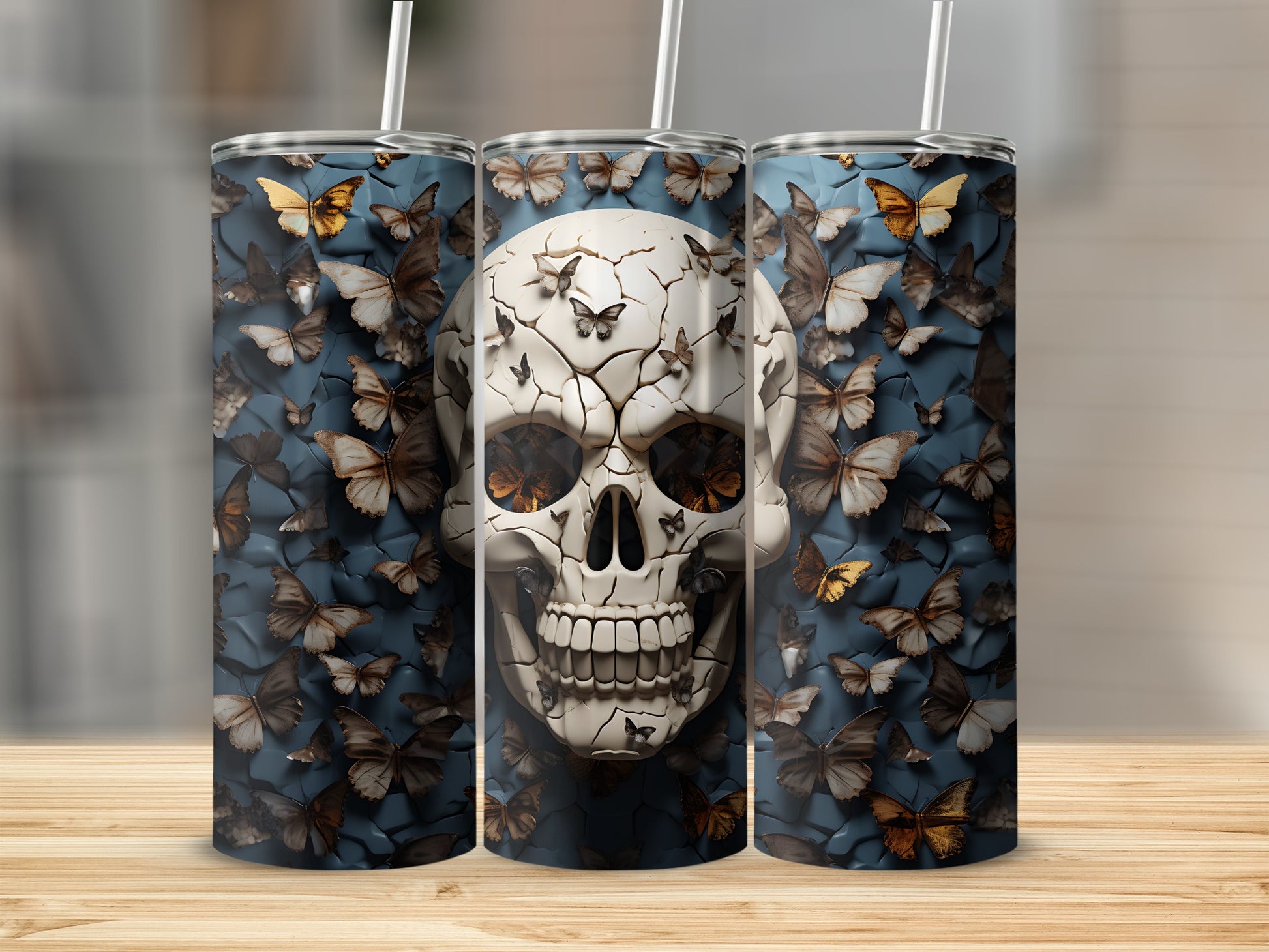 Three tumblers with a skull and butterfly pattern.