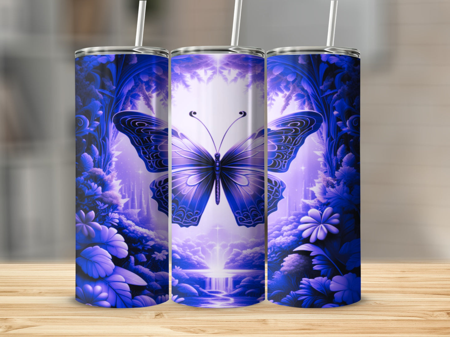 Blue butterfly and floral pattern on three tumblers.