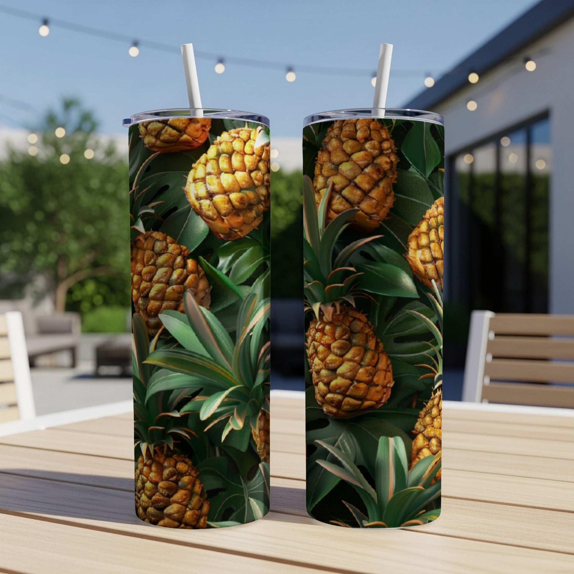 Two tumblers with a tropical pineapple and leaf pattern.