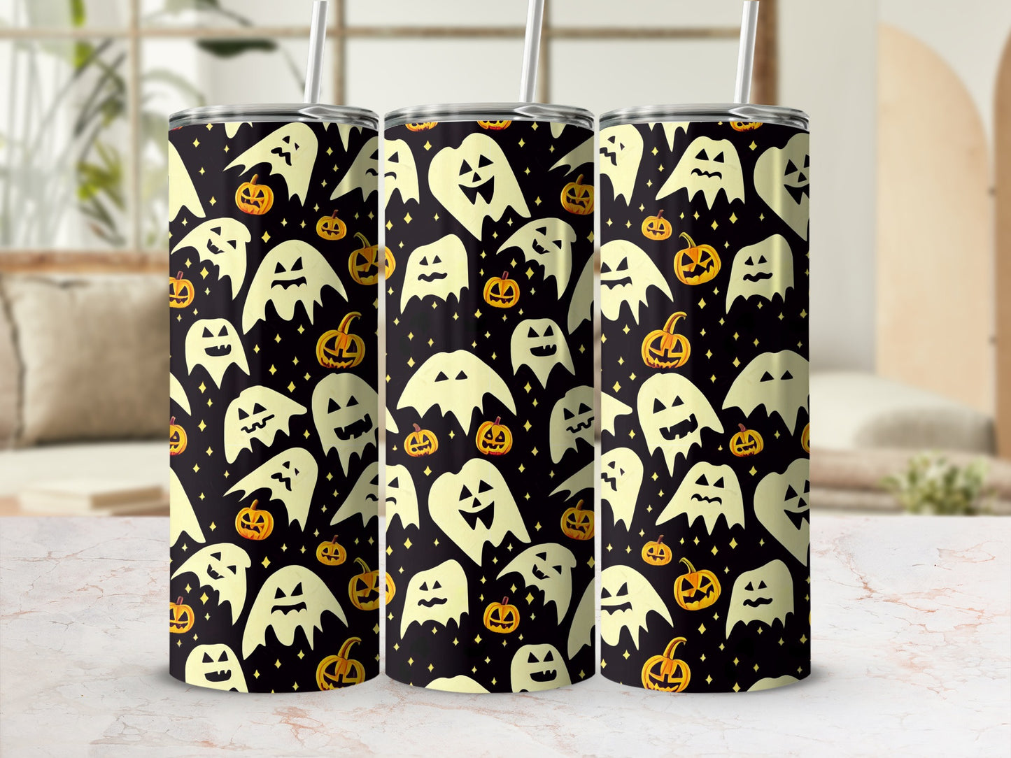 Three tumblers with a black background featuring a pattern of cream-colored ghosts and jack-o'-lanterns.