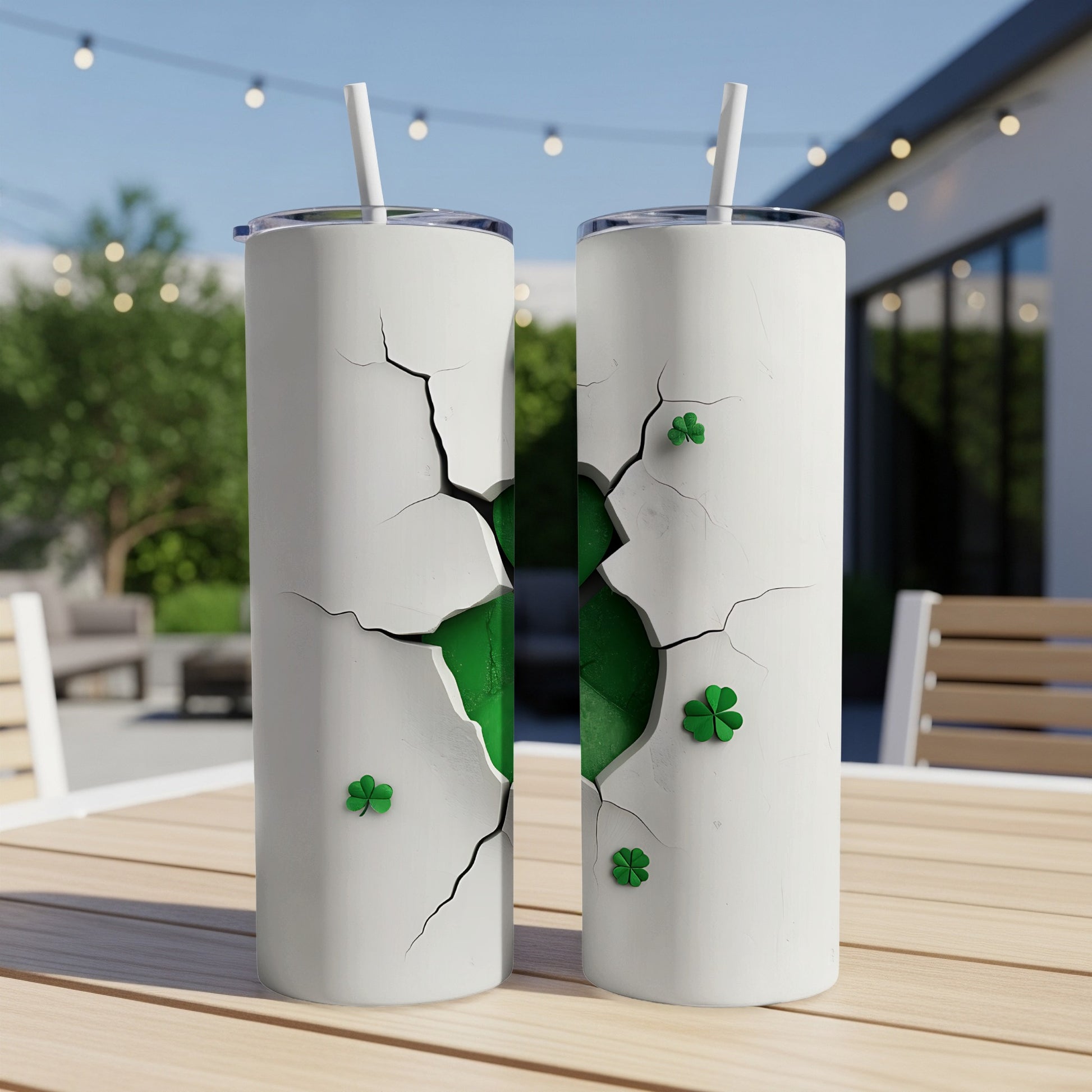 Two white tumblers with cracked design revealing green and shamrocks.