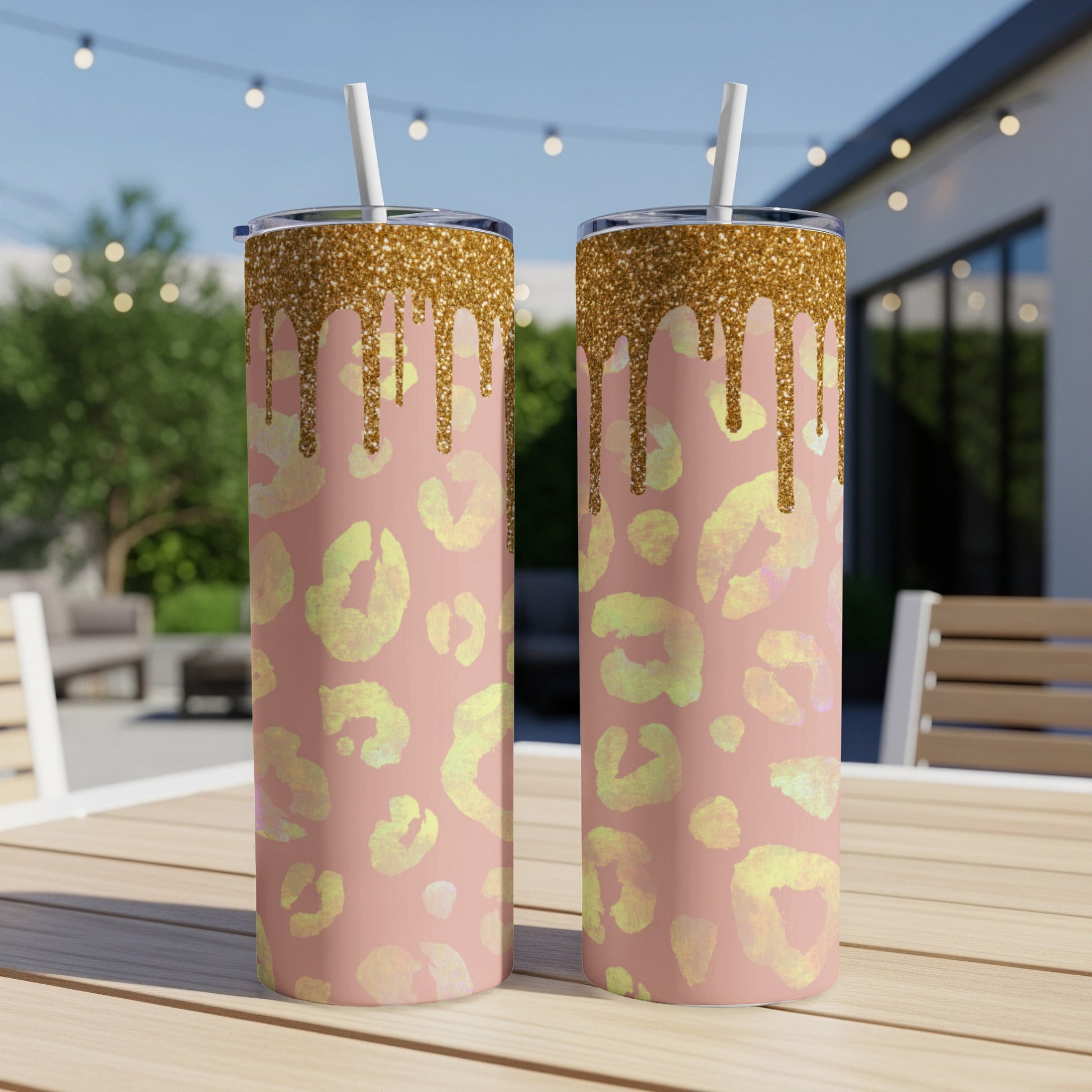Two pink tumblers with gold glitter drip and yellow leopard print pattern.