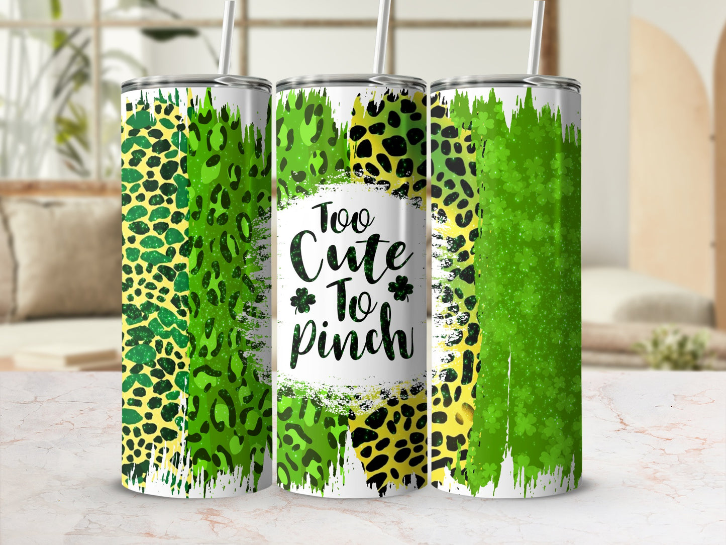 Green leopard print tumbler with "Too Cute To Pinch" text and shamrocks.