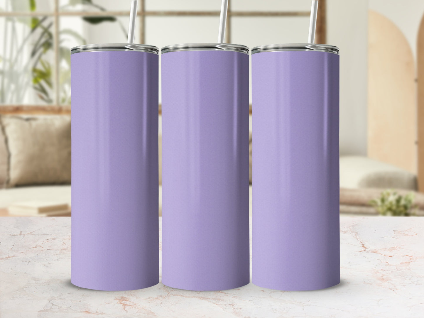Three plain purple tumblers with straws displayed on a marble surface.