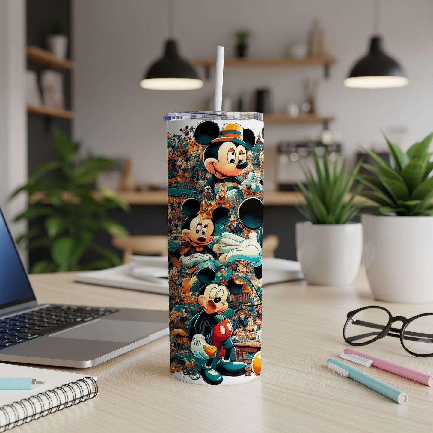 Mickey Mouse collage pattern on a white tumbler with a straw.