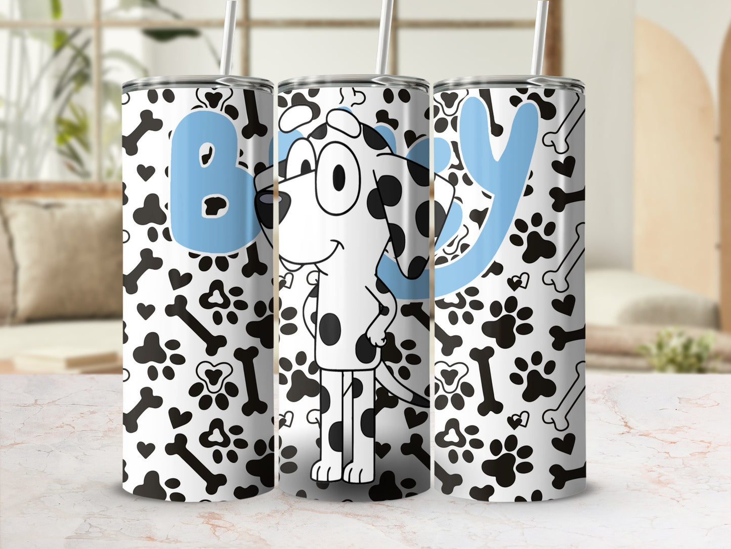 White tumbler with blue "B" and "Y" letters and a cartoon dog.
