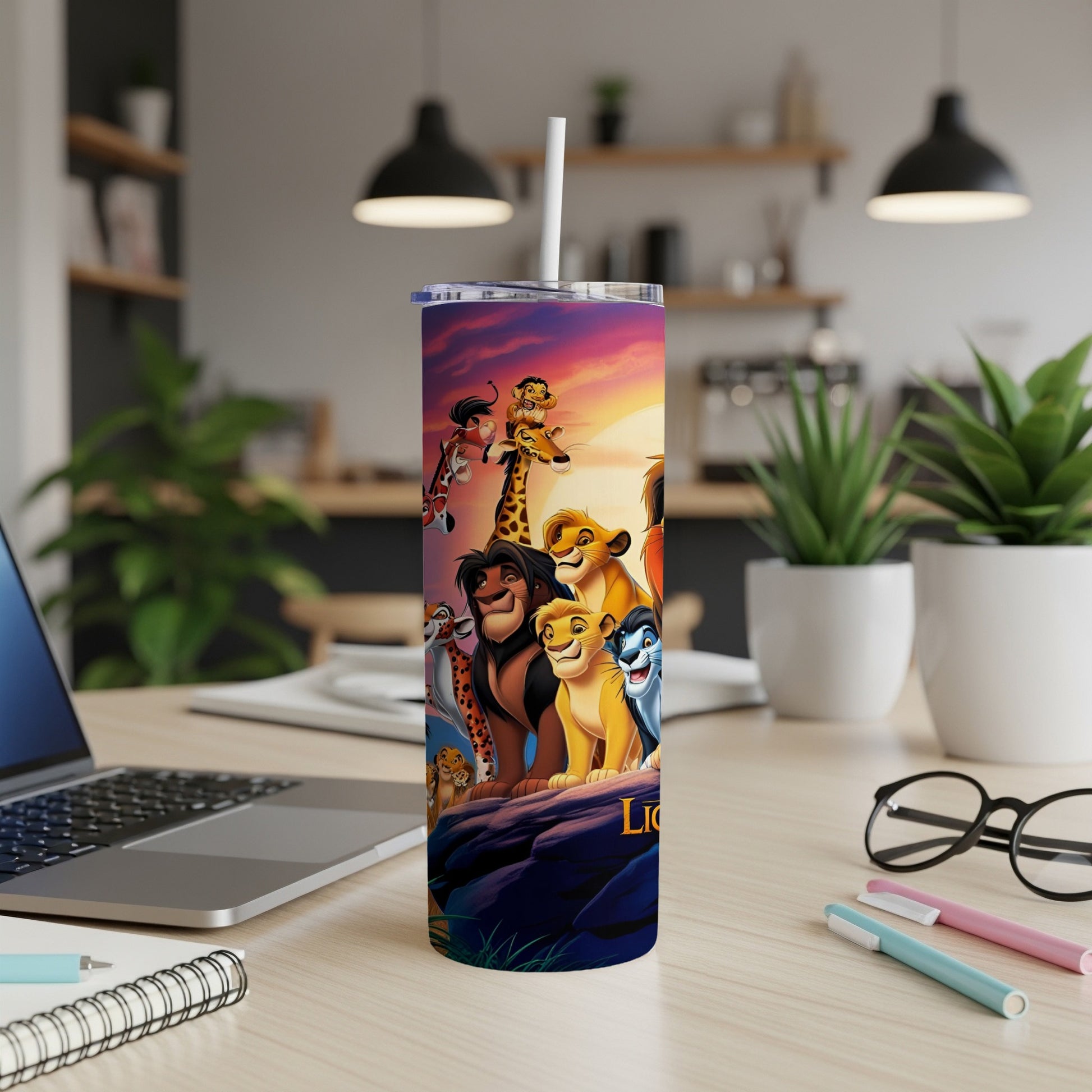 The Lion King characters on a purple gradient tumbler with a straw.
