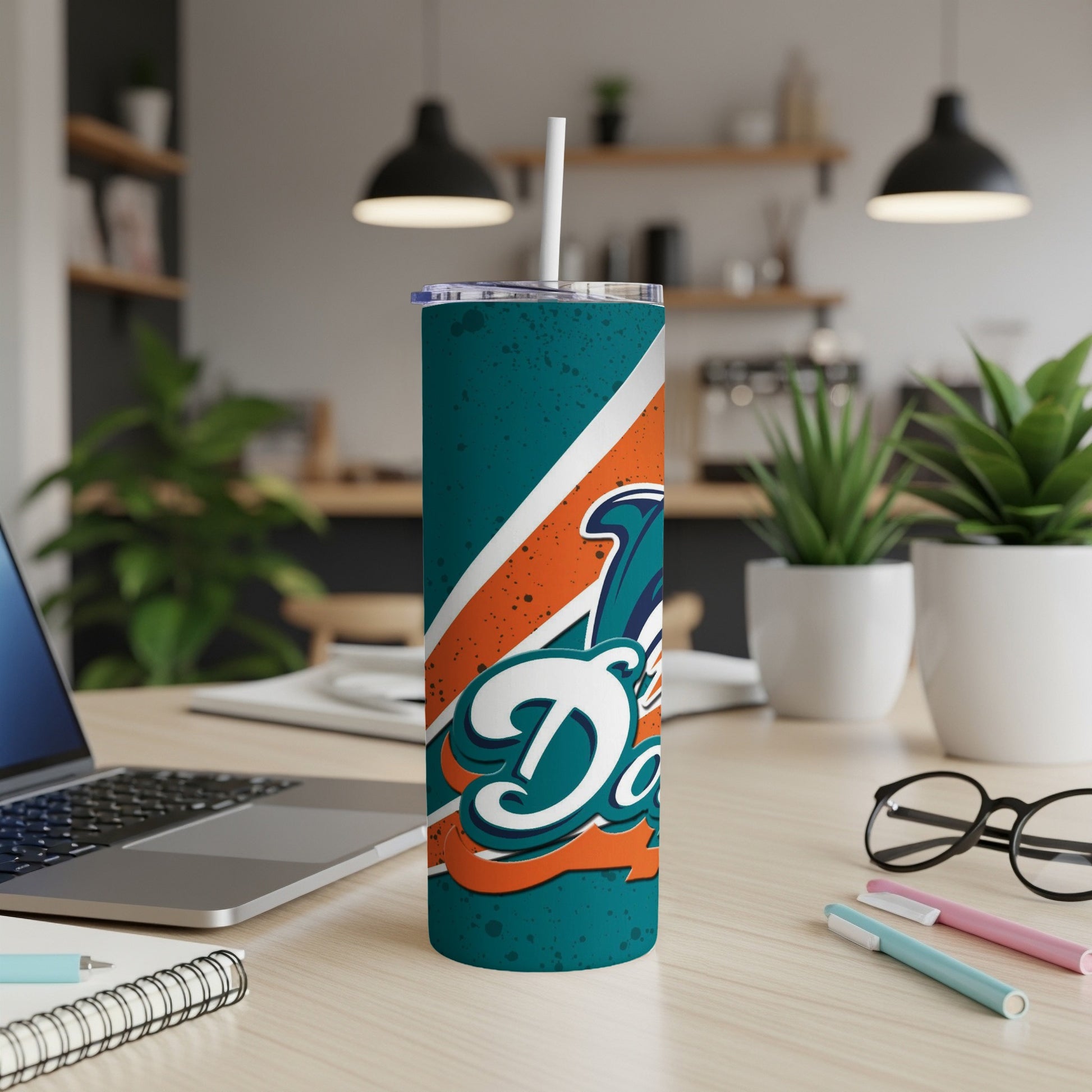 Tumbler with Miami Dolphins logo and teal, orange, and white design.