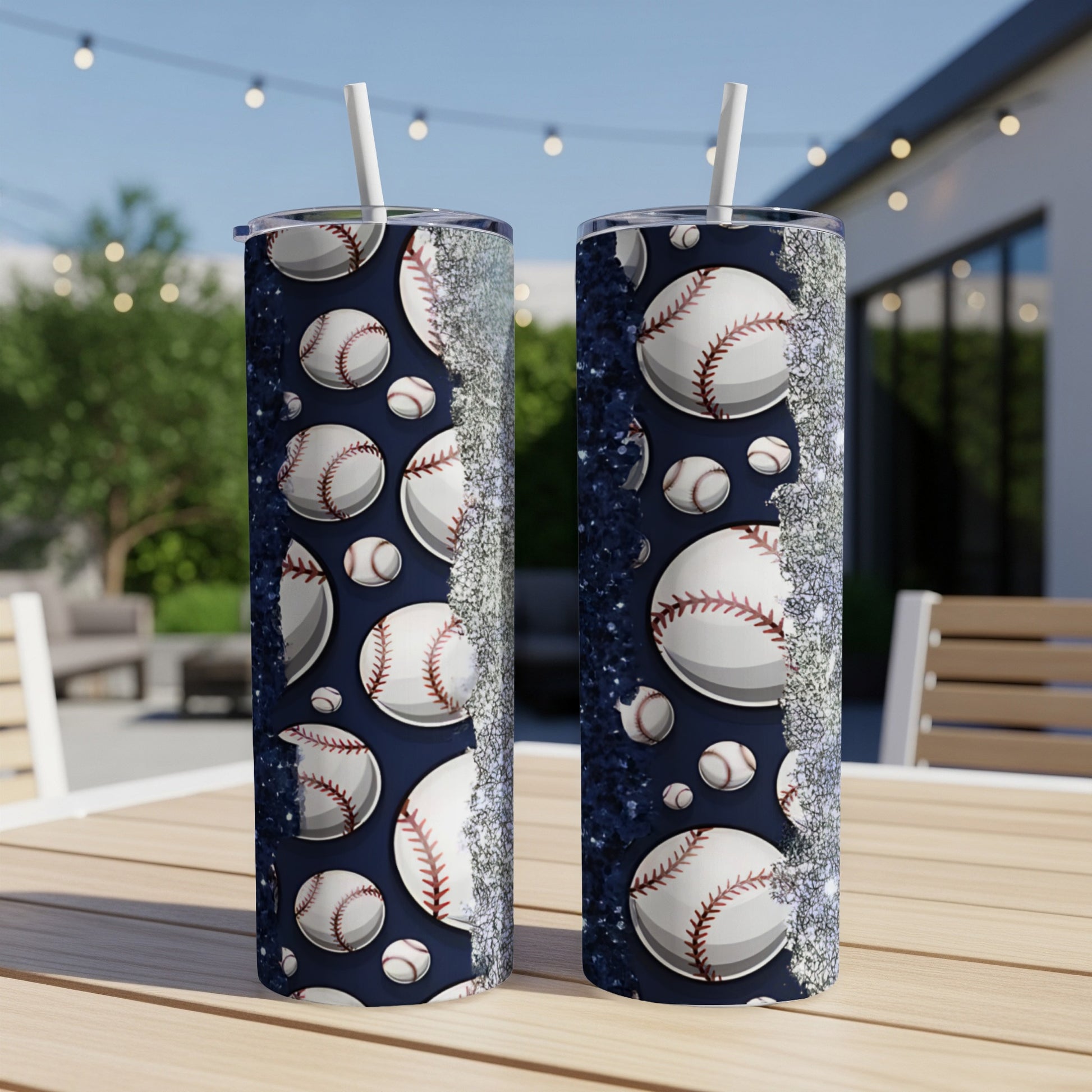 Two baseball-themed tumblers with glitter accents on a table.