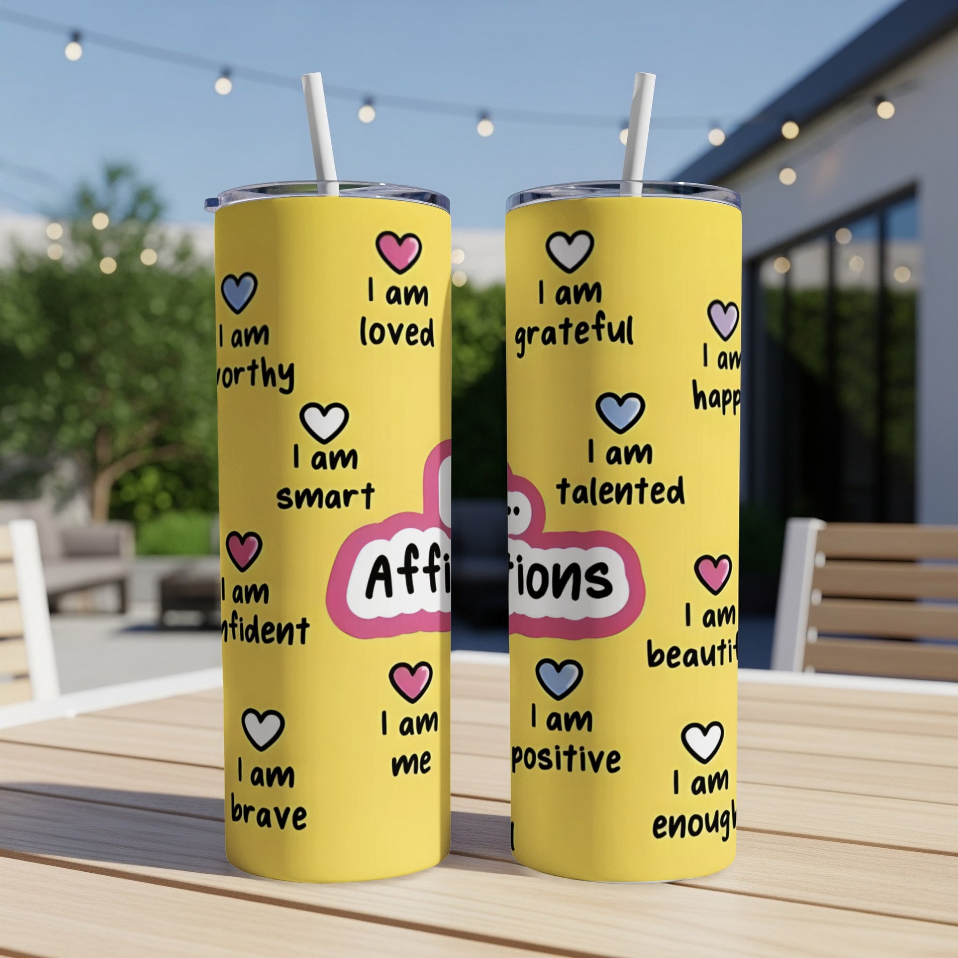 Yellow tumbler with "Affirmations" and positive "I am" statements in pink and blue.