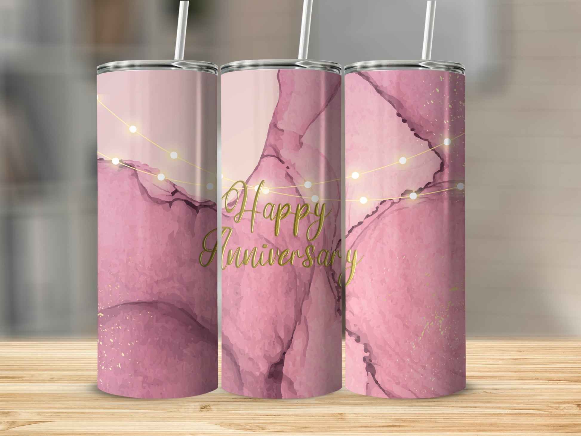 Three pink marble tumblers with gold glitter and "Happy Anniversary" text.
