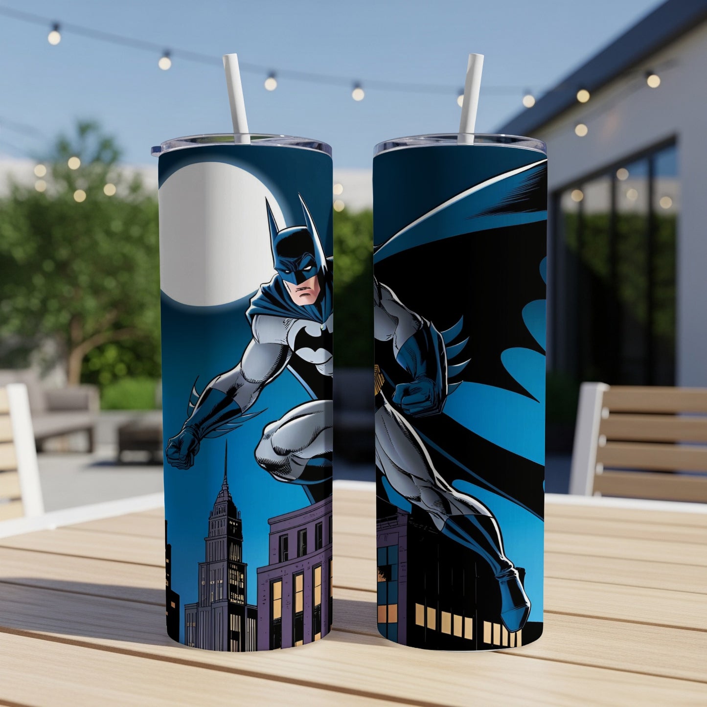Batman leaping from a building at night, two tumblers on a table.