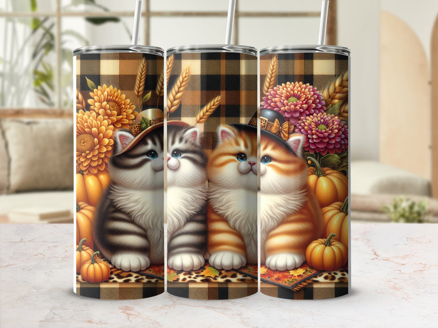 Three kittens sit in front of sunflowers, wheat, and pumpkins with plaid background.