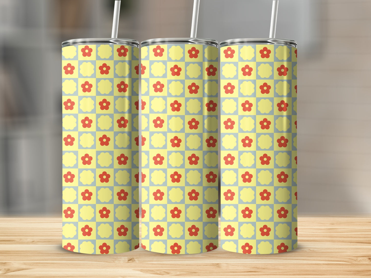 Yellow and light blue checkered pattern with red flowers on three tumblers.