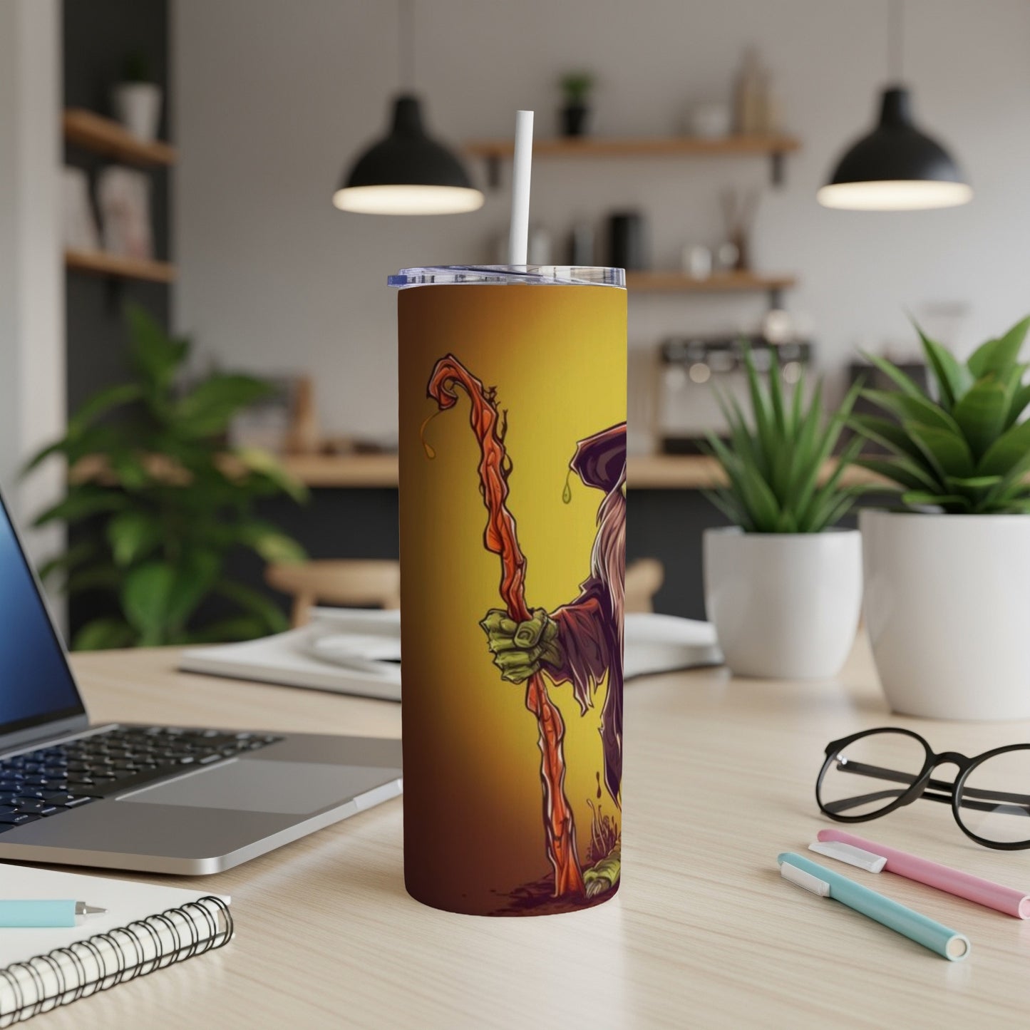 Tumbler with a green-skinned witch holding a dripping staff on a yellow gradient background.