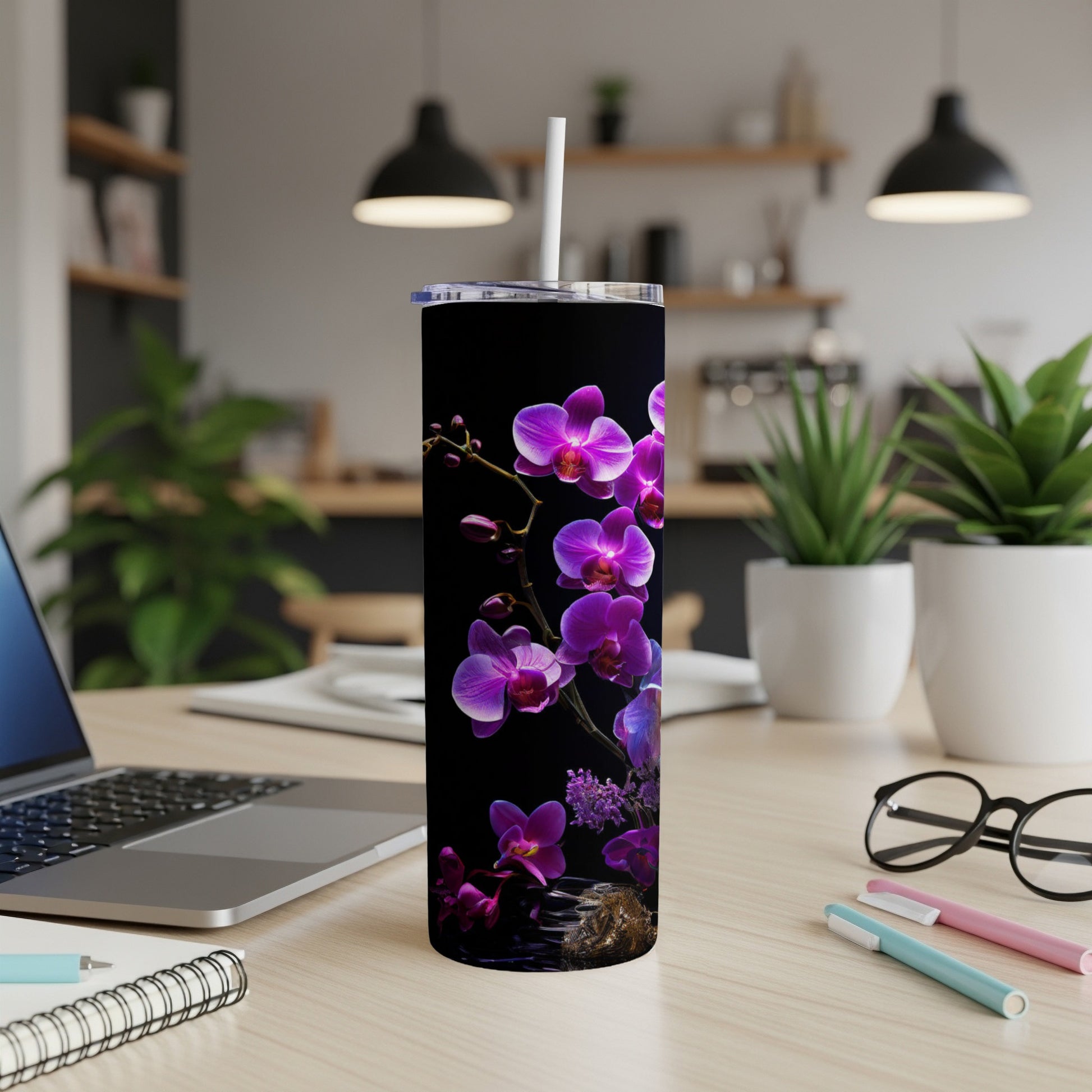 Black tumbler with purple orchids and green leaves.