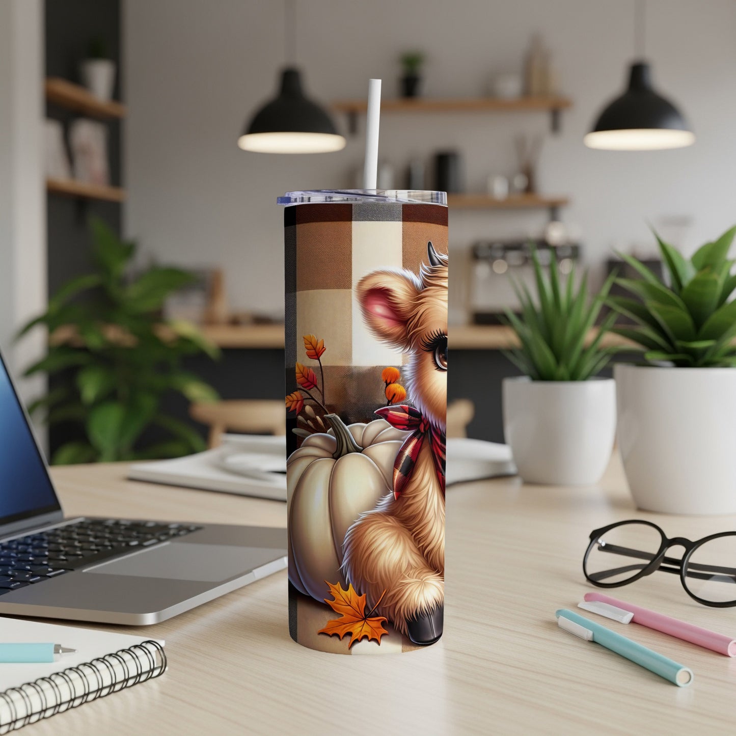 Brown plaid tumbler with a cartoon cow, pumpkin, and fall leaves.