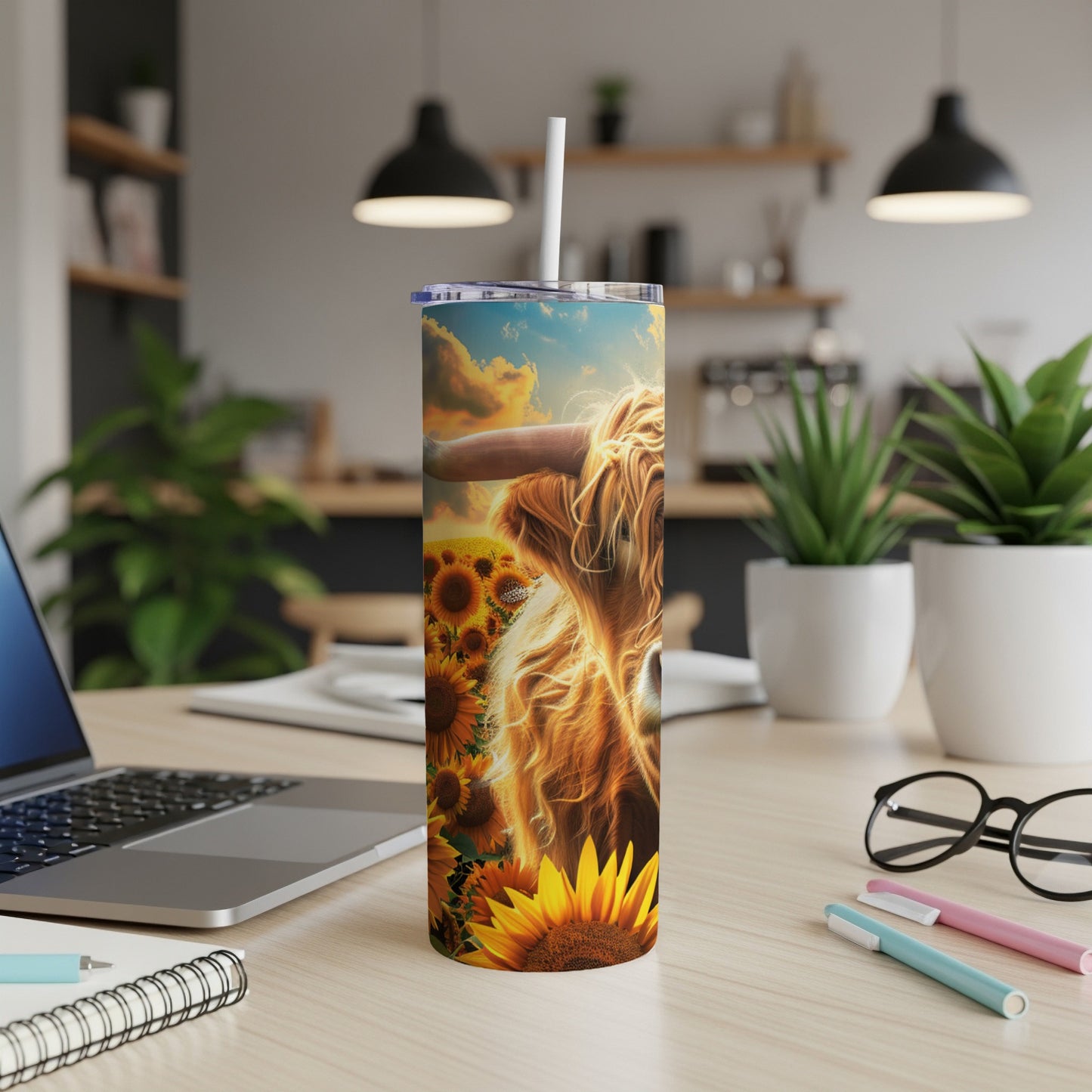 Highland cow and sunflowers design on a tumbler.