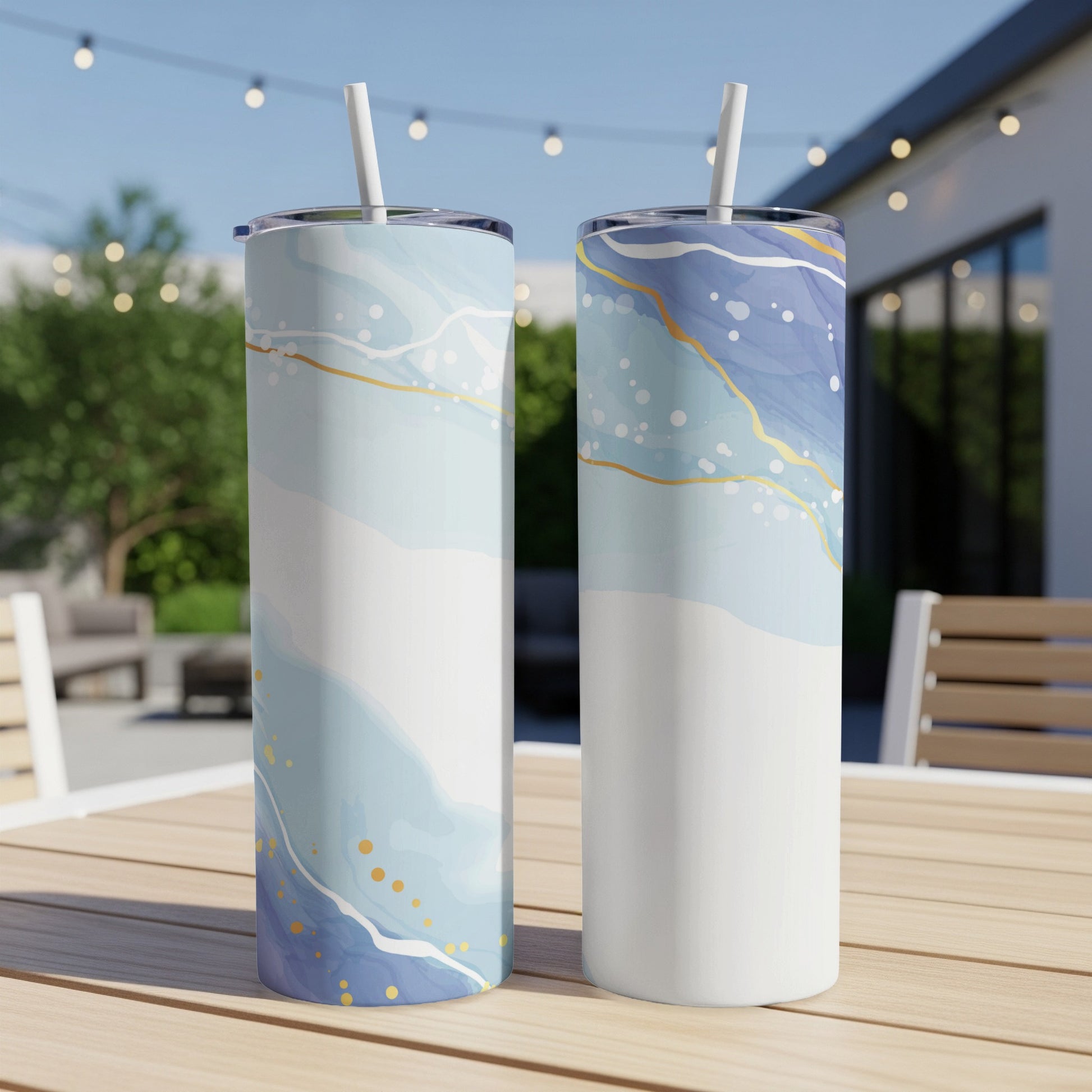 Two tall tumblers with blue and white marble pattern and gold accents.