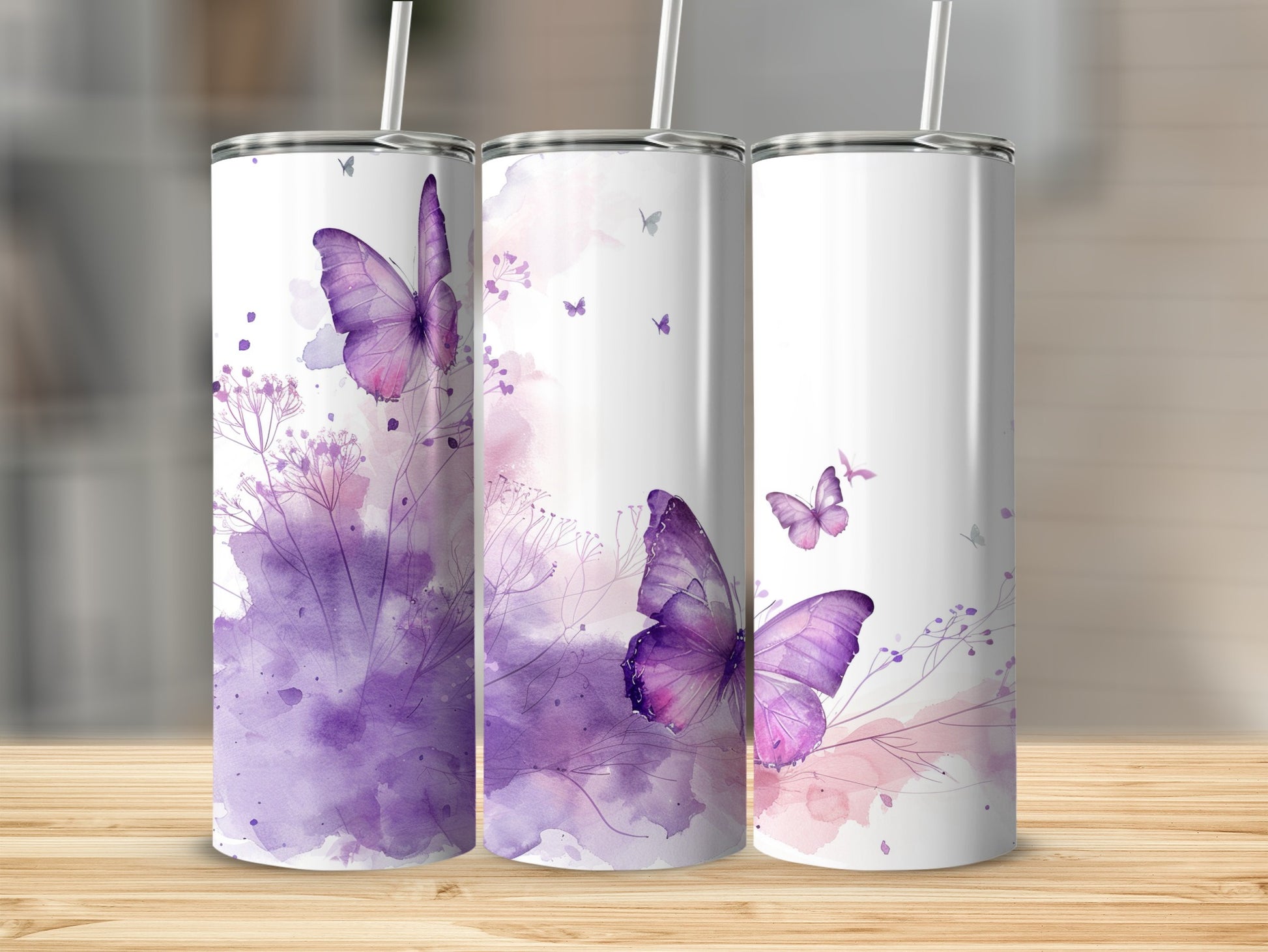 Three white tumblers with purple watercolor butterflies and floral accents.