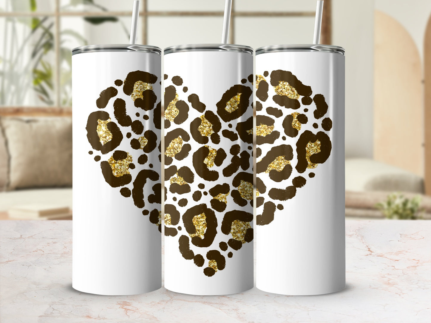 Three white tumblers with leopard print hearts and gold glitter accents.