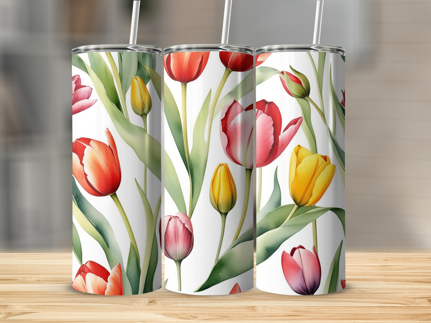 Tall tumblers with a watercolor tulip pattern in red, pink, and yellow.