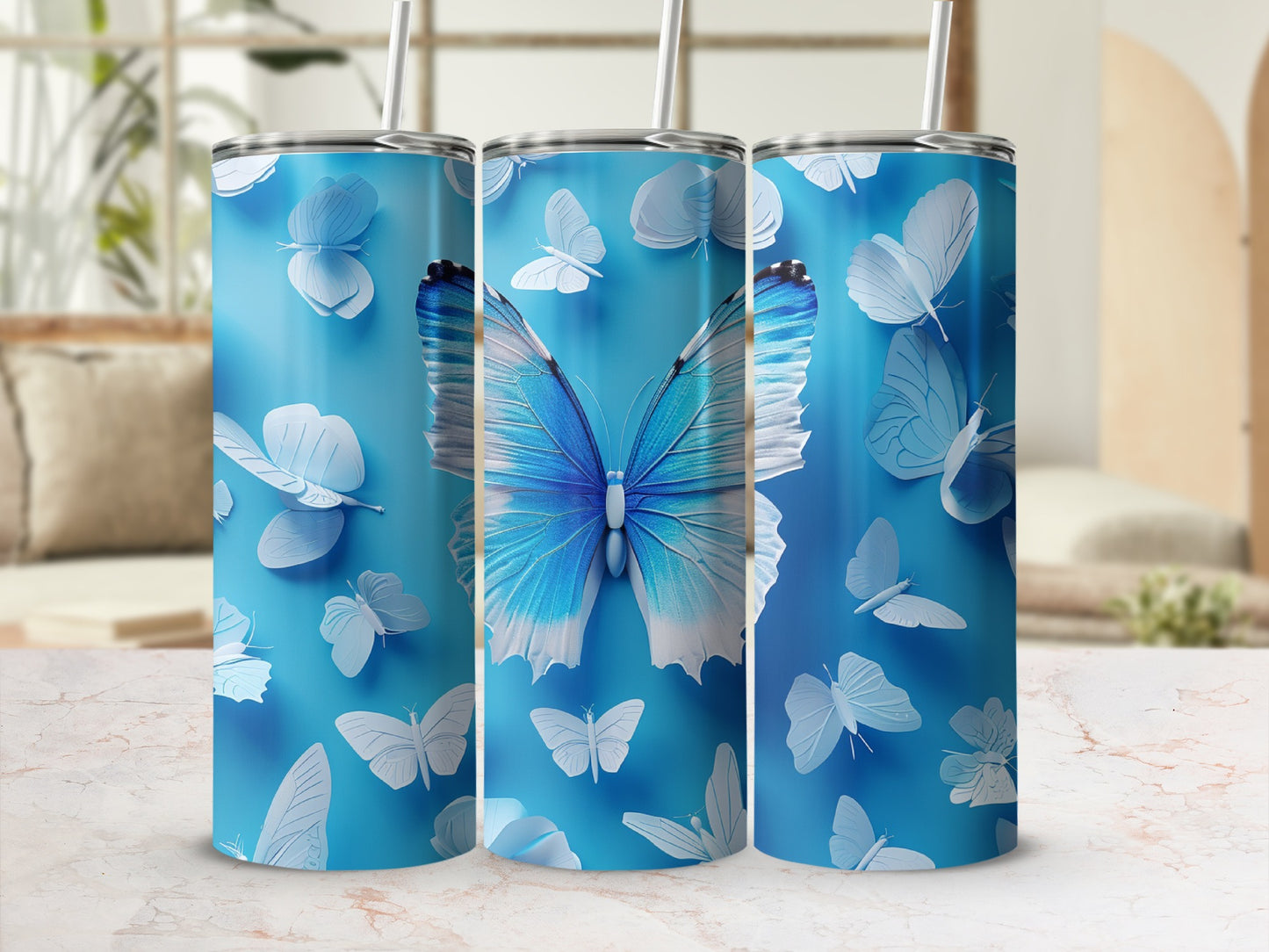 Blue tumbler with white and blue butterflies and a central large blue butterfly.