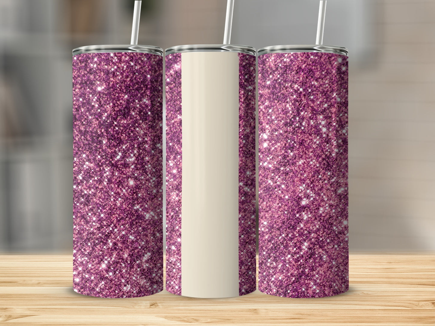 Three glittery purple tumblers with a cream-colored section on a wooden surface.