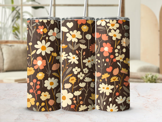 Three tumblers with a brown floral pattern and straws.
