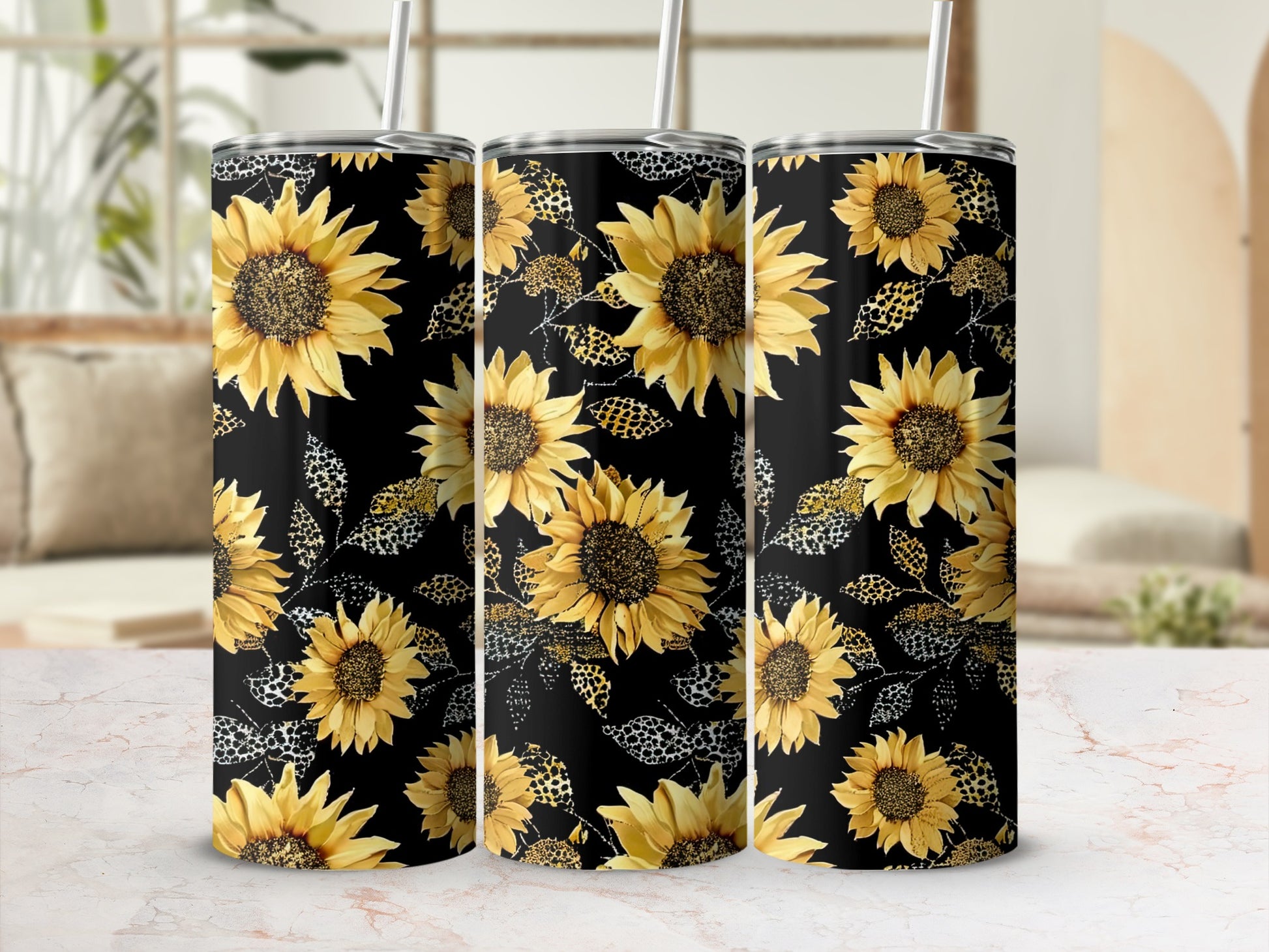 Three tumblers with a black background featuring sunflowers and leopard print.